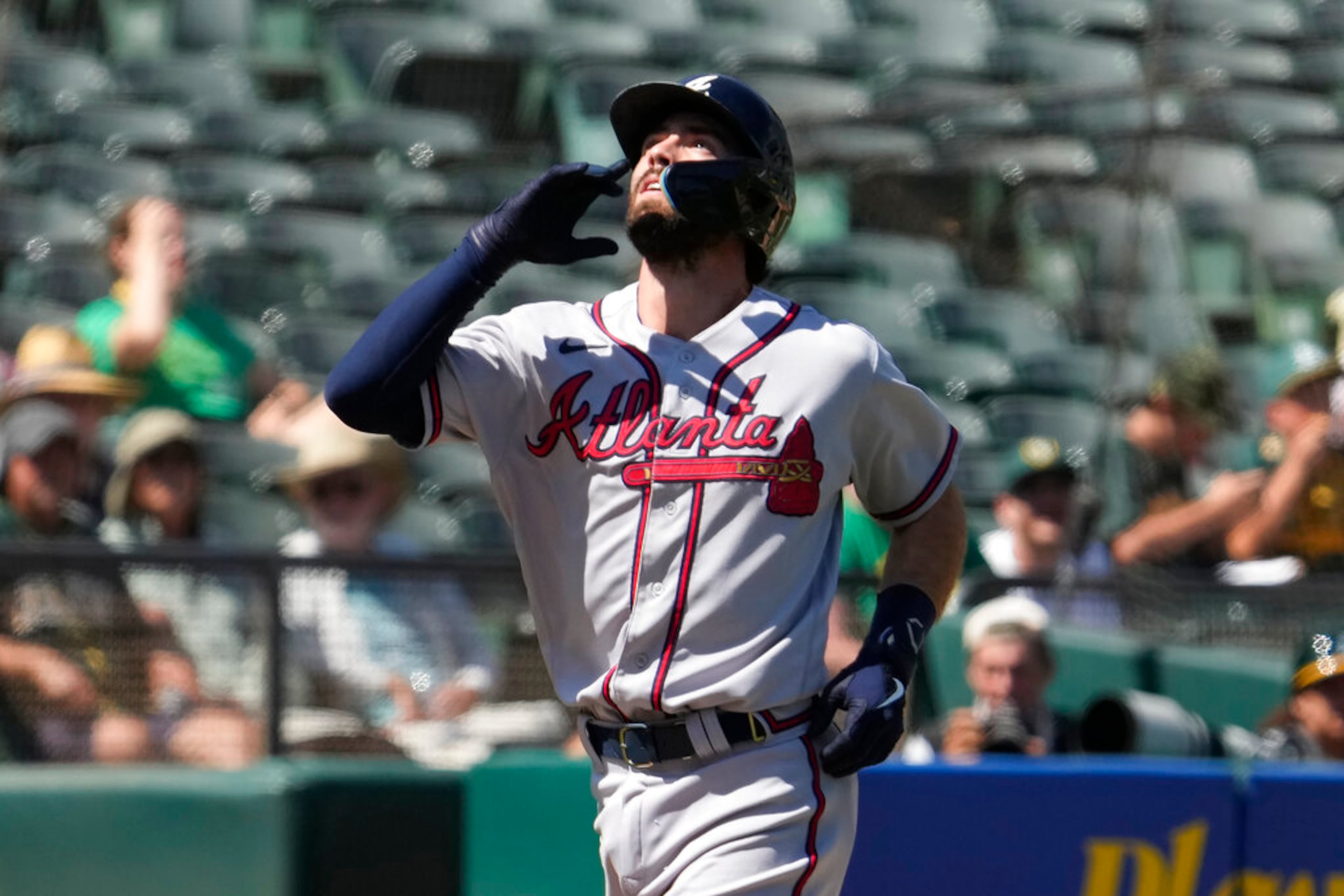 Atlanta Braves' Dansby Swanson points to the sky as he crosses home plate after hitting a solo home run against Oakland Athletics during the sixth inning of a baseball game in Oakland, Calif., Wednesday, Sept. 7, 2022. (AP Photo/Tony Avelar)