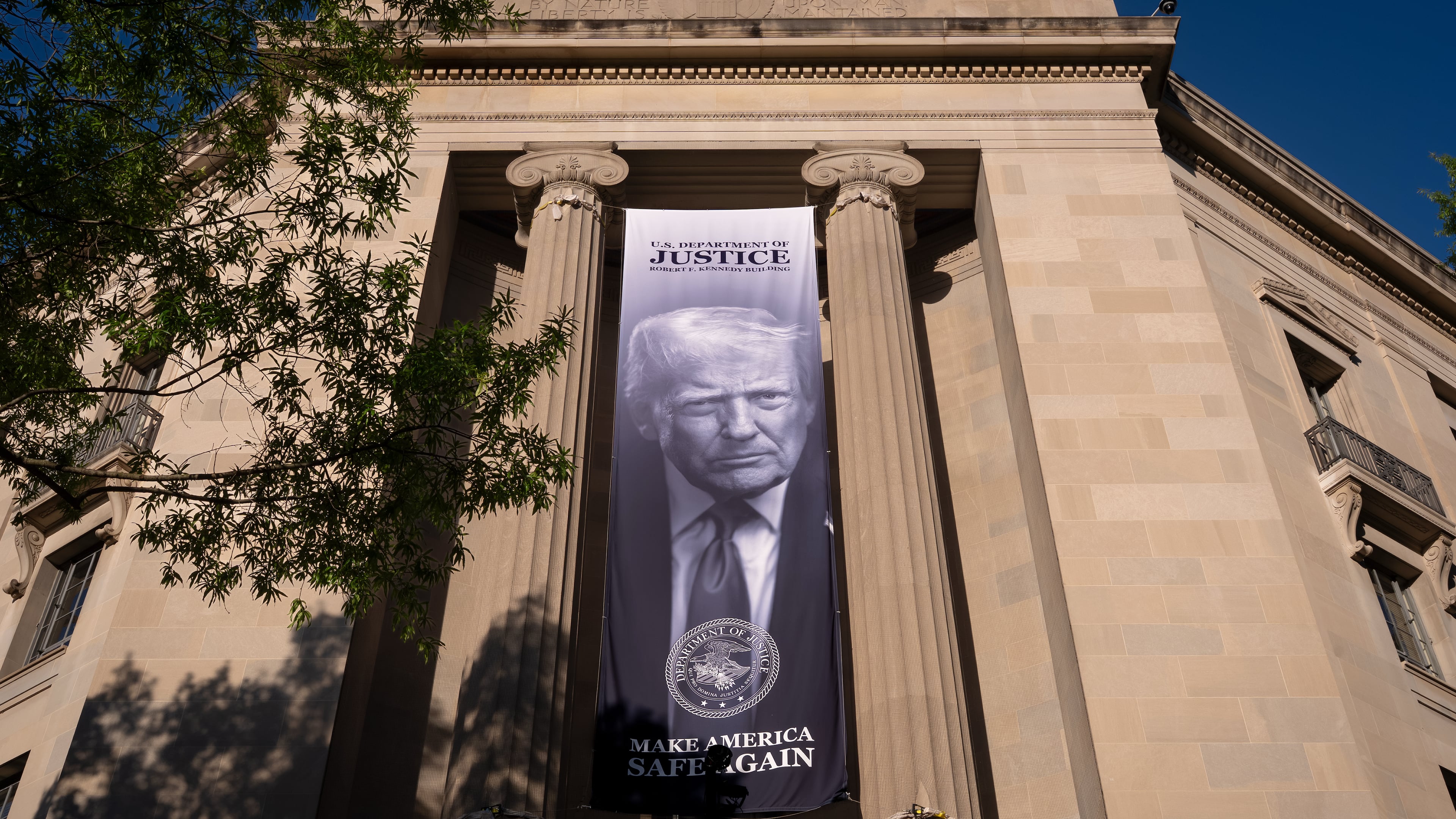 FILE - A portrait of President Donald Trump is displayed at the Justice Department building in Washington, June 2, 2026. (AP Photo/J. Scott Applewhite, File)