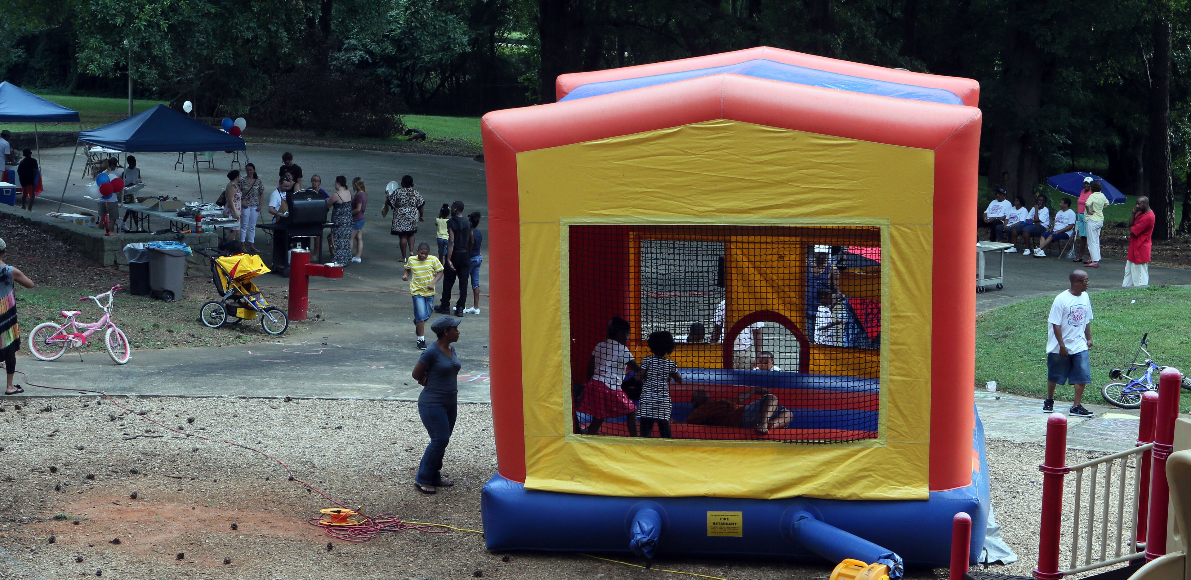 Children romped in a blow up bouncy house at the Parkview Community Recreational Center in Atlanta during the 30th anniversary of National Night Out on Tuesday.