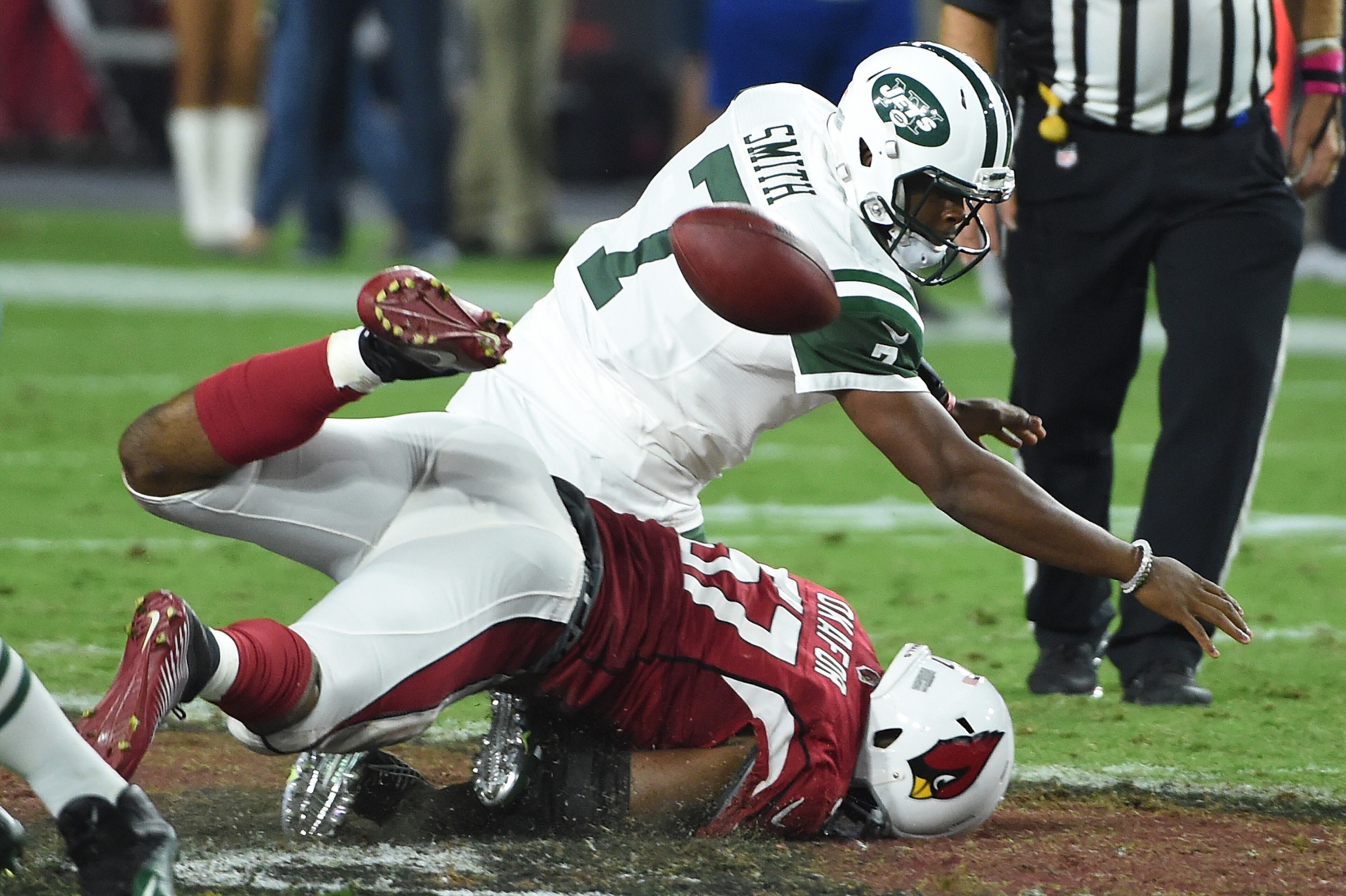 GLENDALE, AZ - OCTOBER 17: Quarterback Geno Smith #7 of the New York Jets is sacked by outside linebacker Alex Okafor #57 of the Arizona Cardinals during the fourth quarter of the NFL game at University of Phoenix Stadium on October 17, 2016 in Glendale, Arizona. (Photo by Norm Hall/Getty Images) *** BESTPIX ***