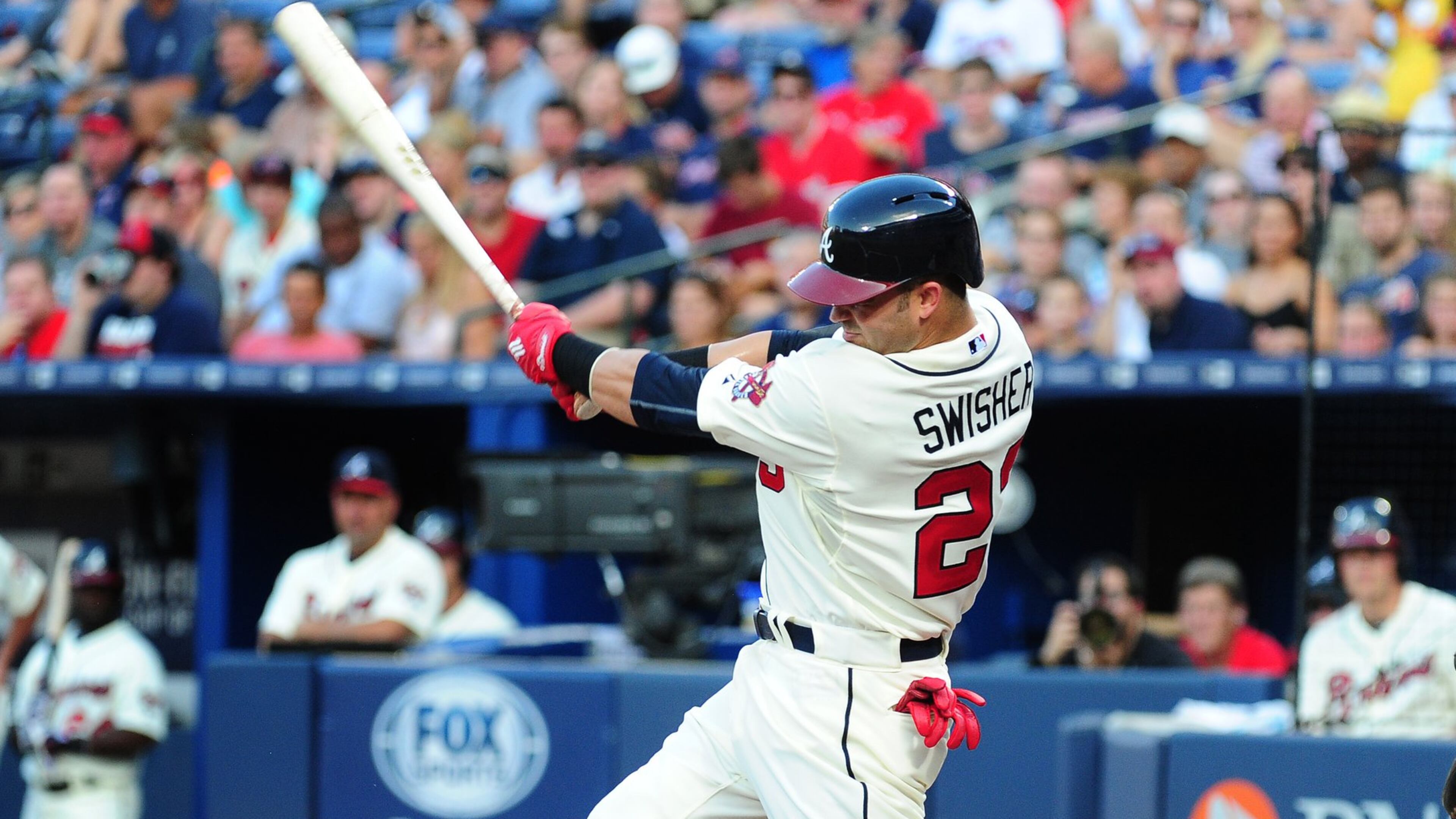 Nick Swisher had a two-run double Saturday in his first game since being traded to the Braves. (Photo by Scott Cunningham/Getty Images)