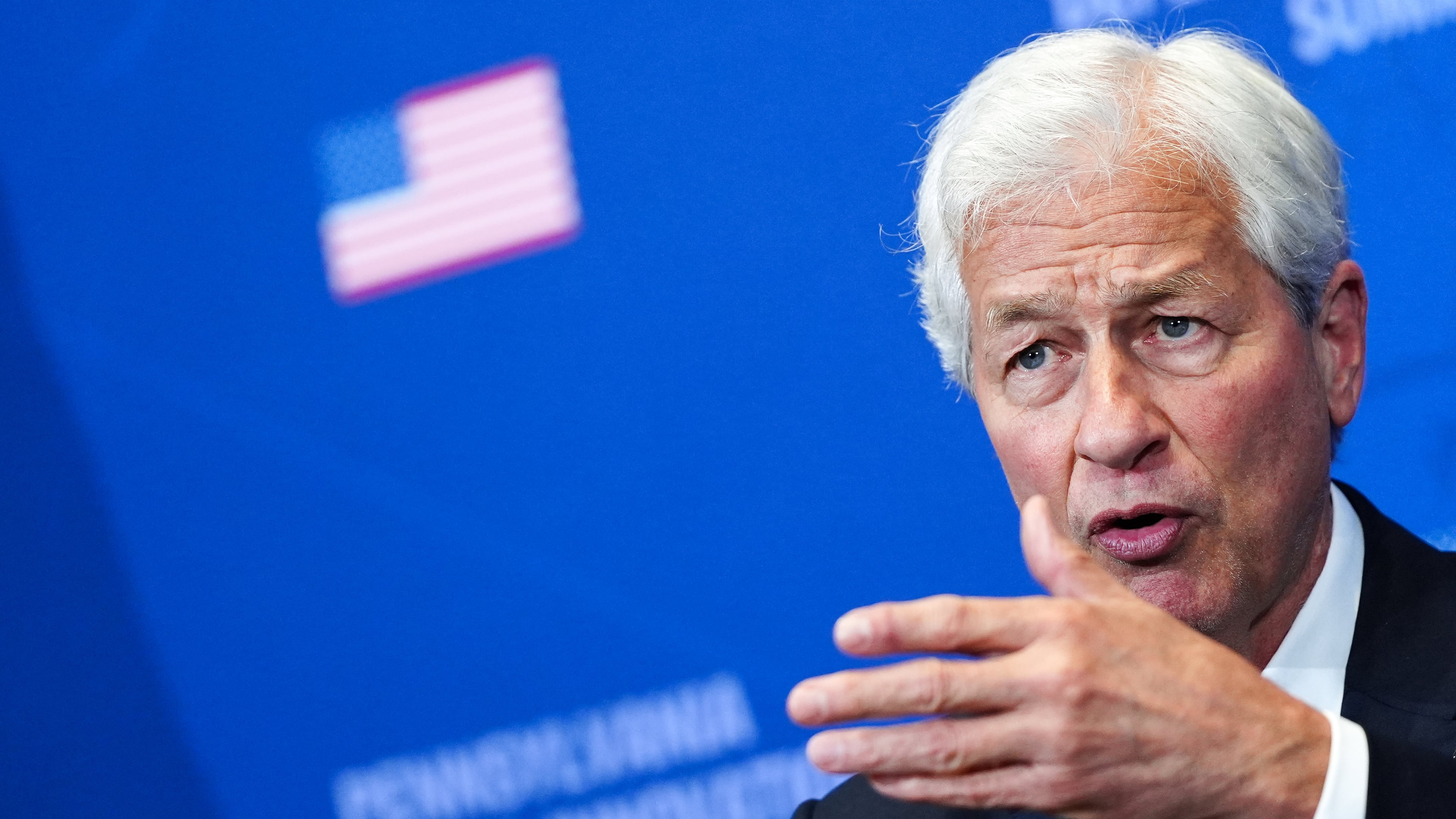 FILE - Jamie Dimon, chairman and CEO of JP Morgan Chase, listens as President Donald Trump speaks during a roundtable at the Pennsylvania Defense and Innovation Summit, Wednesday, July 15, 2026, at the United States Army War College in Carlisle, Pa. (AP Photo/Julia Demaree Nikhinson, File)