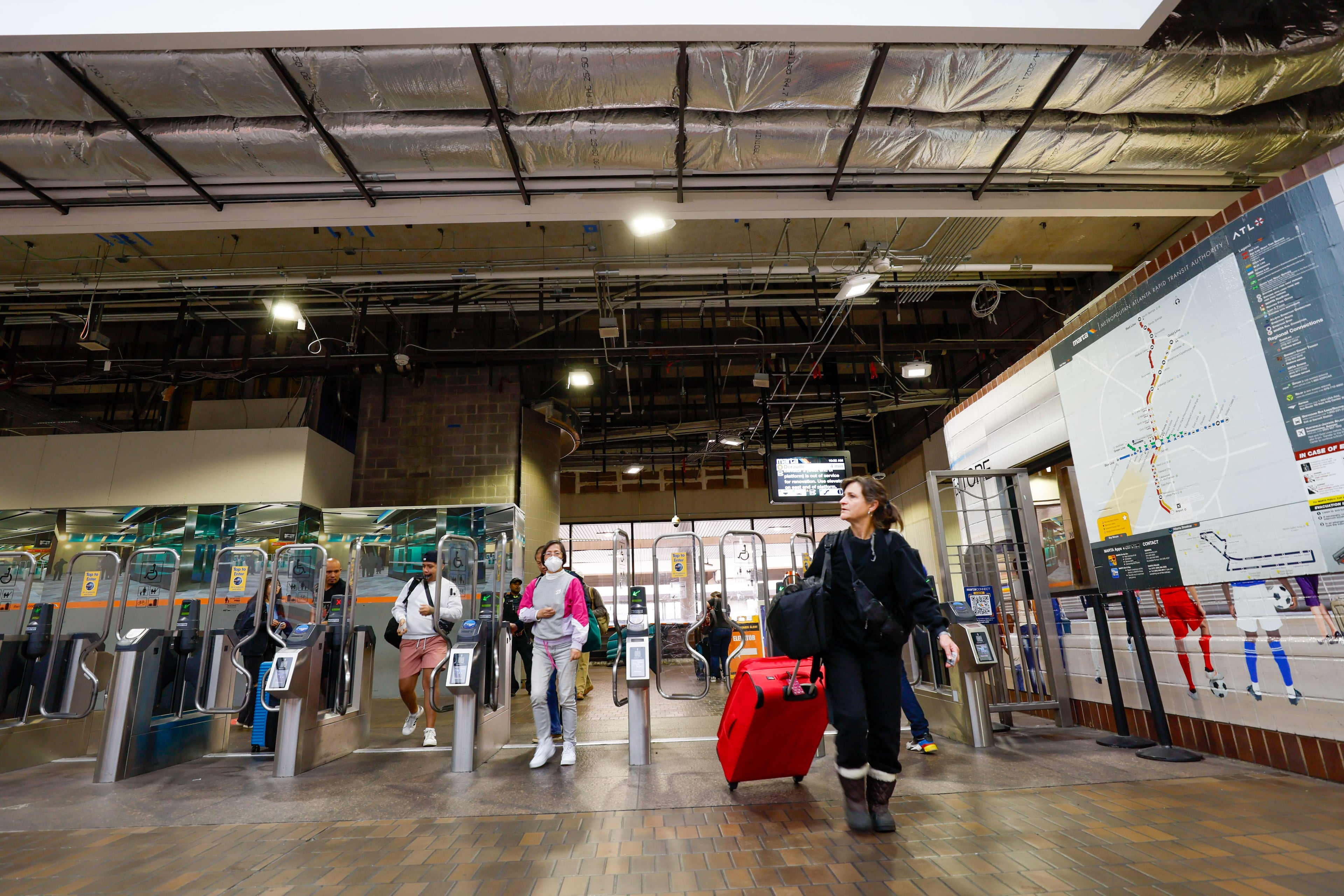 Passengers and travelers are seen leaving the MARTA station at the airport on Tuesday, Feb. 27, 2024. The station is starting to work on a significant renovation and will close to the public on April 8th.
Miguel Martinez /miguel.martinezjimenez@ajc.com