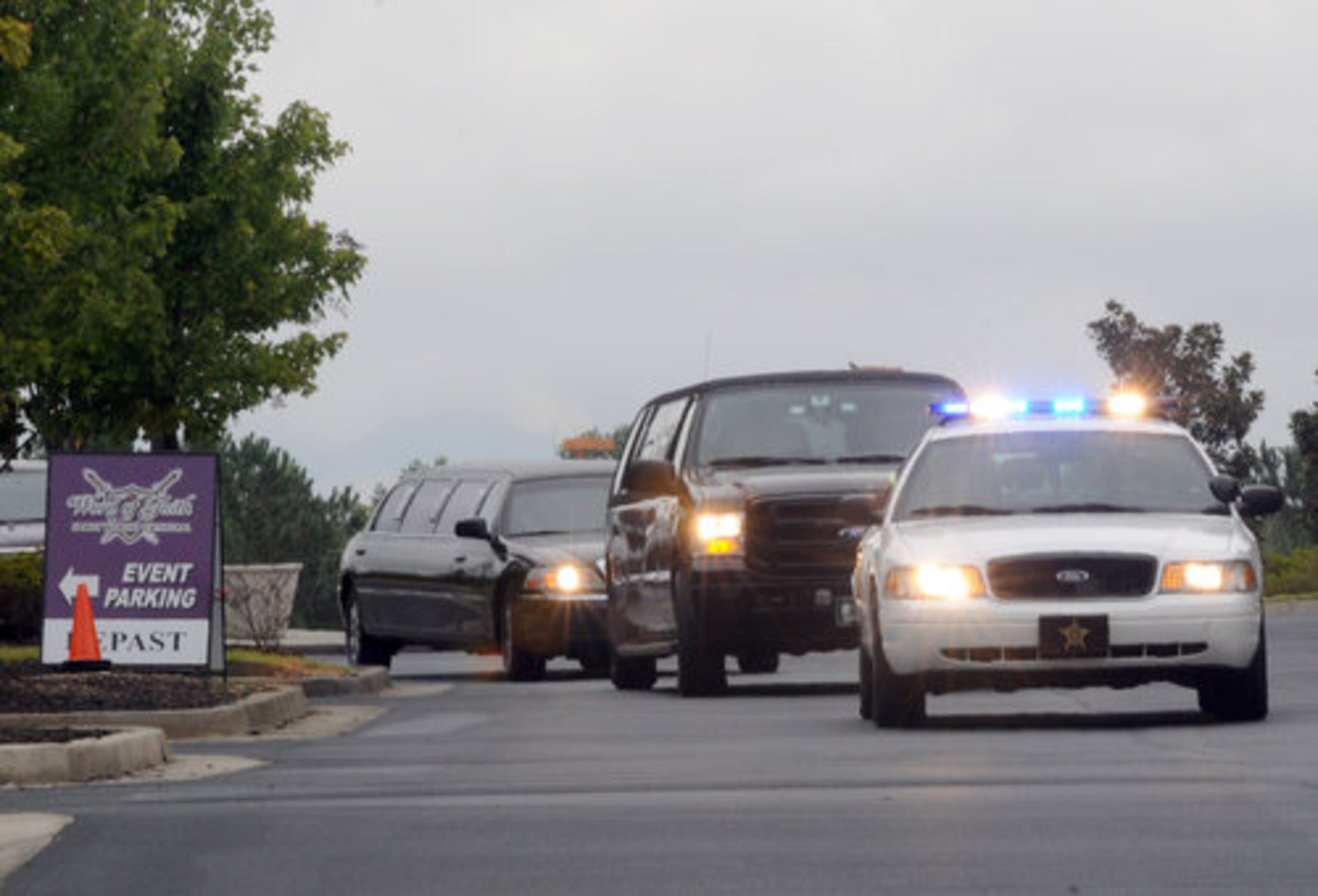 An escorted motorcade of mourners arrives for the funeral service for Denver Broncos wide receiver Kenny McKinley at the Word of Faith Family Worship Cathedral on Monday, Sept. 27, 2010, in Austell, Ga. McKinley died of an apparent suicide at his home on Sept. 20.