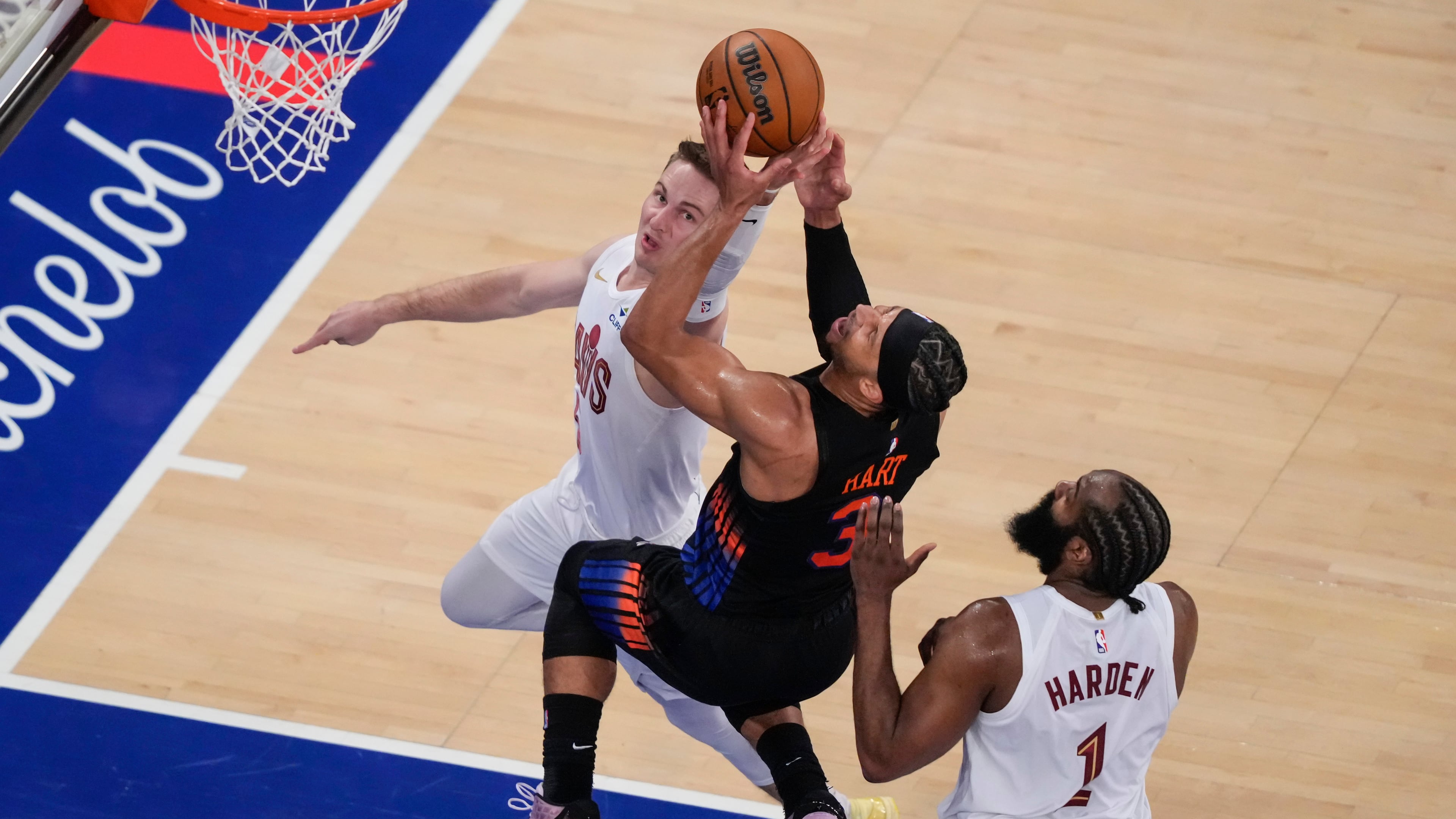 New York Knicks guard Josh Hart (3) is blocked by Cleveland Cavaliers guard Sam Merrill (5) during the second half of Game 2 in the Eastern Conference finals NBA basketball playoffs series, Thursday, May 21, 2026, in New York. (AP Photo/Yuki Iwamura)