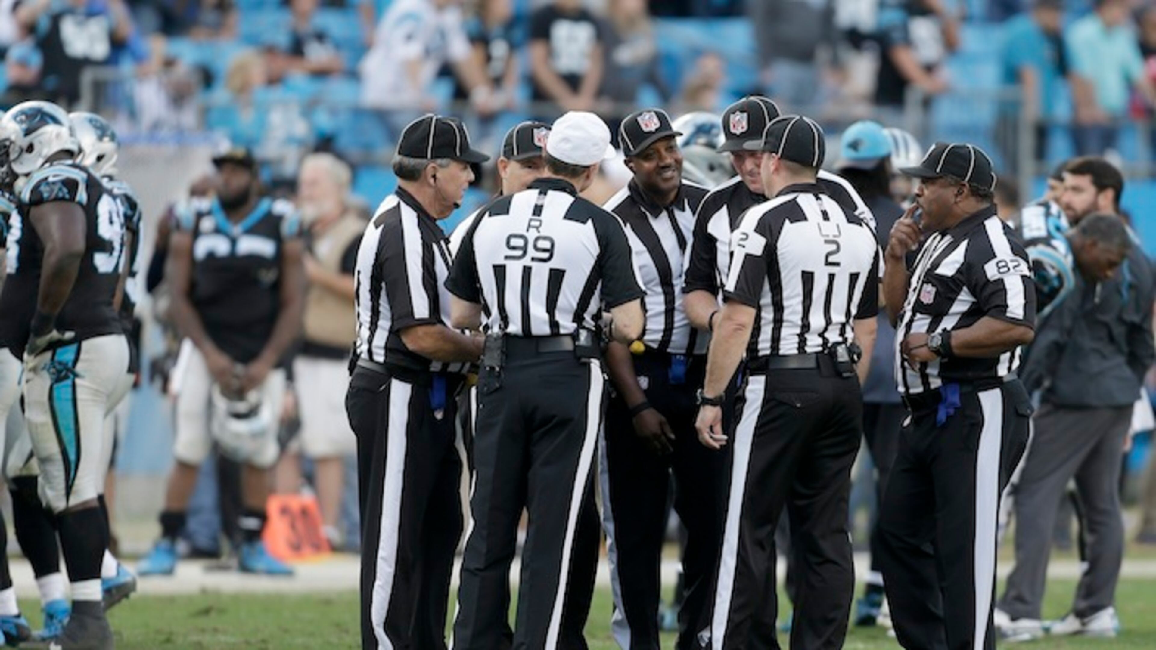 NFL officials huddle at the two minute warning during the second half of an NFL football game between the Atlanta Falcons and Carolina Panthers in Charlotte, N.C., Sunday, Dec. 13, 2015. The Carolina Panthers won 38-0.(AP Photo/Bob Leverone)