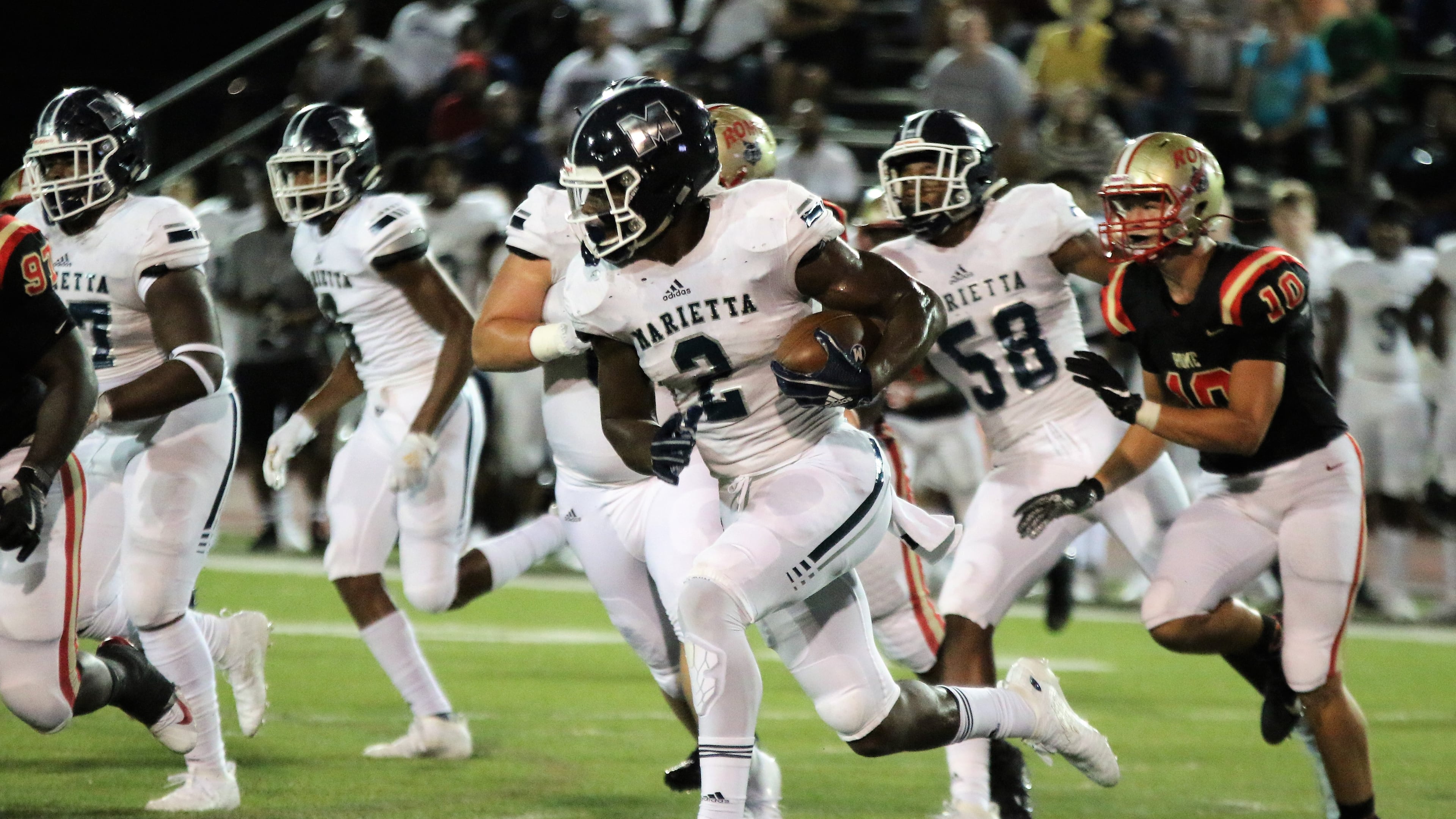 Marietta's Arik Gilbert runs the ball against Rome during the first quarter of Thursday's game at Barron Stadium in Rome. (Jeremy Stewart/Special)