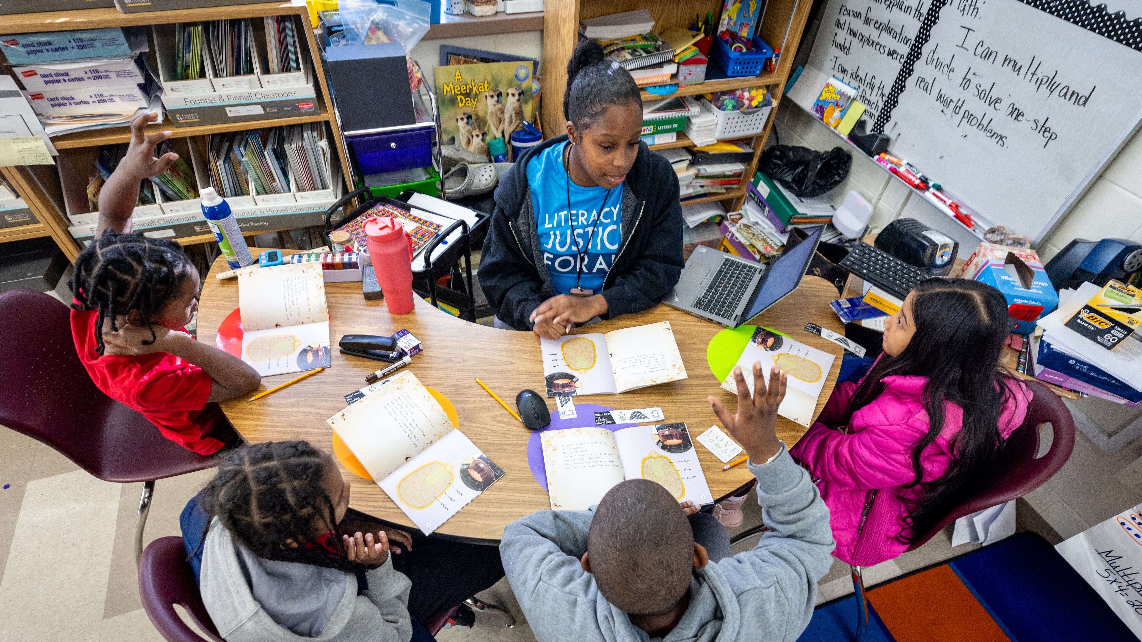 Shamaudie McClendon works with her third grade students on their reading skills at Kimberly Elementary School in Atlanta on Tuesday, Dec. 5, 2023. In the new state budget, Georgia lawmakers inserted nearly $8 million toward literacy mandates they adopted last year. (Steve Schaefer/steve.schaefer@ajc.com)