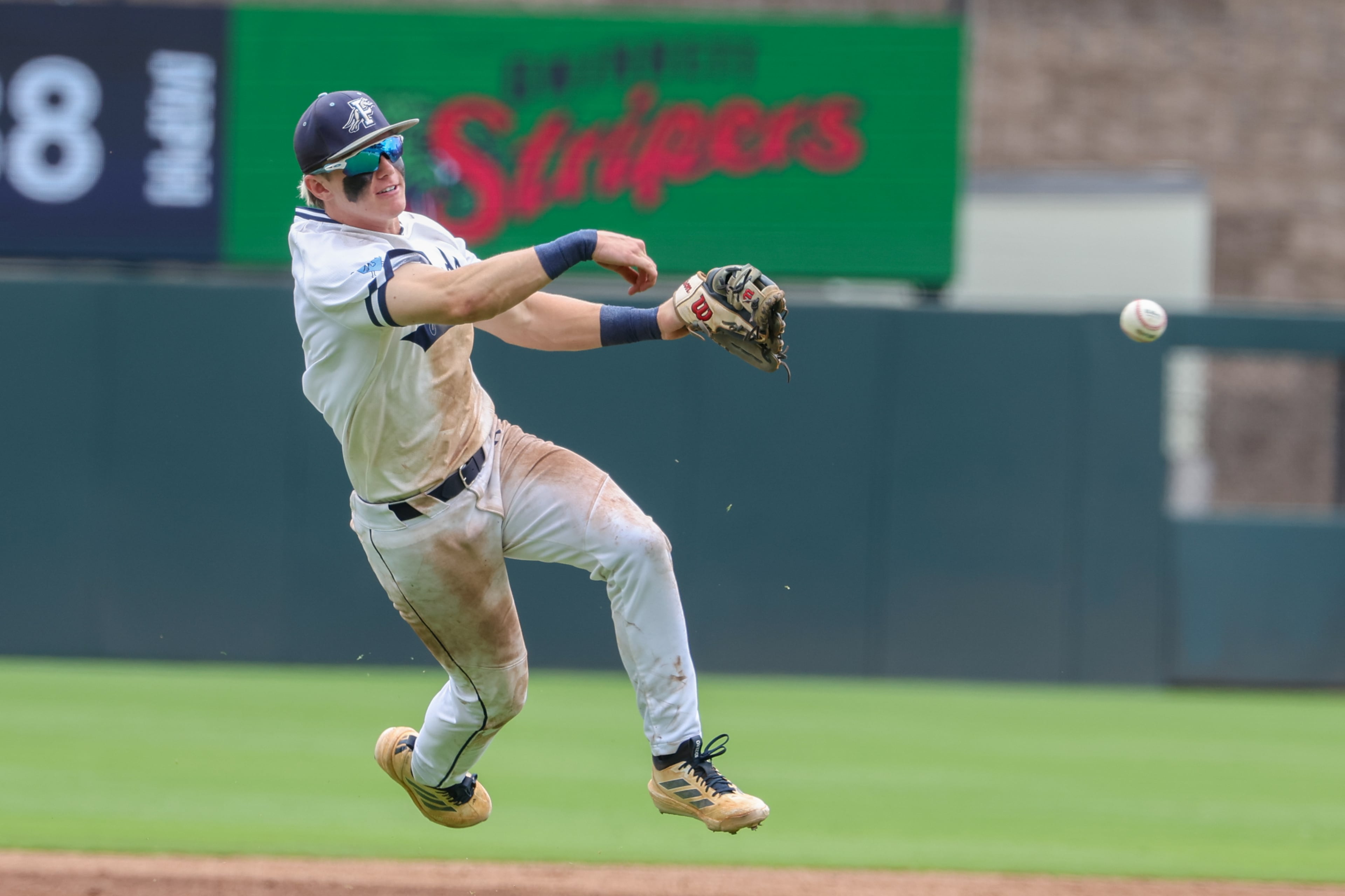 Pope’s Luke Winbush throws to first during Game 2 of their GHSA Class 5A baseball championship series against Loganville at Gwinnett Field on Tuesday, May 26, 2026, in Lawrenceville. (Arvin Temkar/AJC)