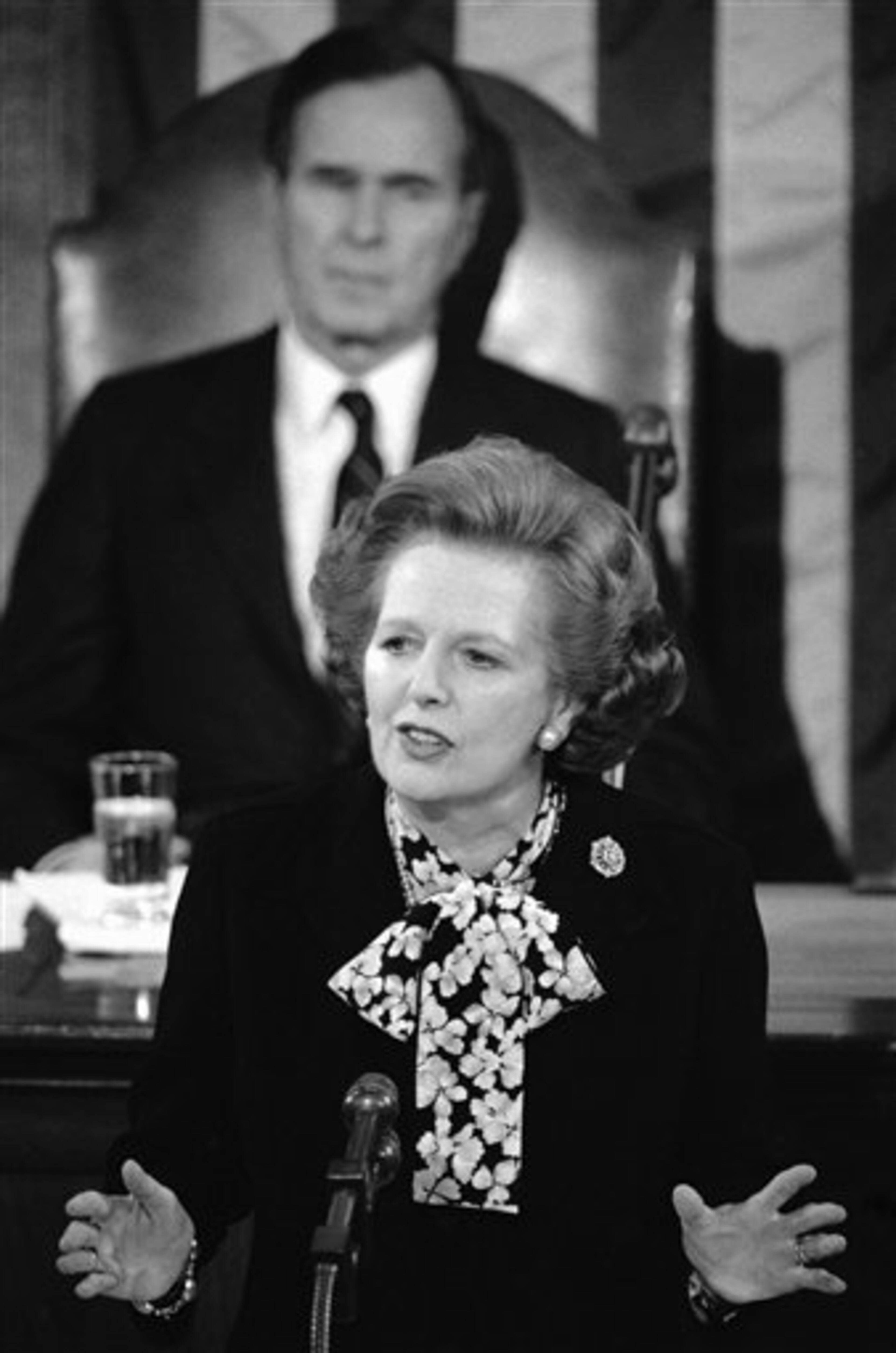 British Prime Minister Margaret Thatcher address a joint session of Congress, Wednesday, Feb. 20, 1985 in Washington as Vice President George H. Bush looks on. Mrs. Thatcher, who is having political troubles in Britain, asked to be the first British Prime Minister to address Congress since Winston Churchill in 1952. (AP Photo/Bob Daugherty)