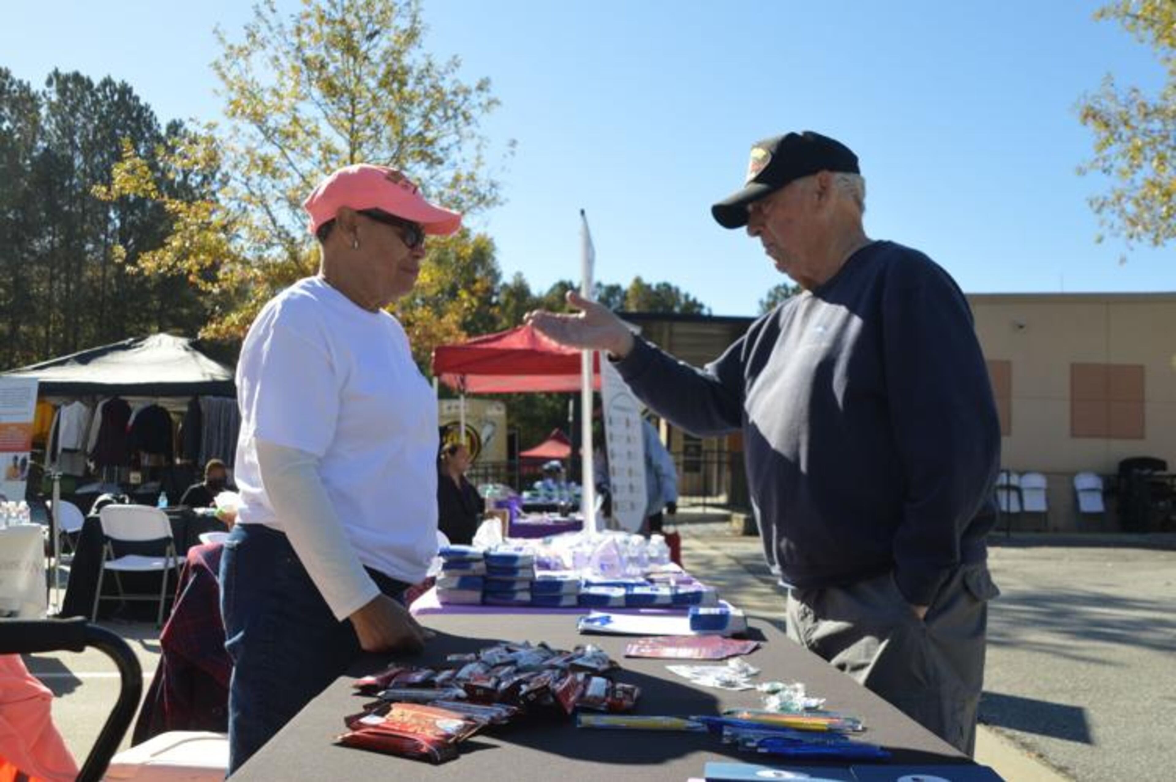 Lilburn resident Joseph Acquista, right, chats with a representative of VWP at the organization's booth during Gwinnett County's Stand Down event for military veterans on Nov. 4. Acquista, a Vietnam War veteran, said the county's Veteran and Family Services Center helped him get set up with assistance to treat PTSD. (Photo Courtesy of Curt Yeomans)