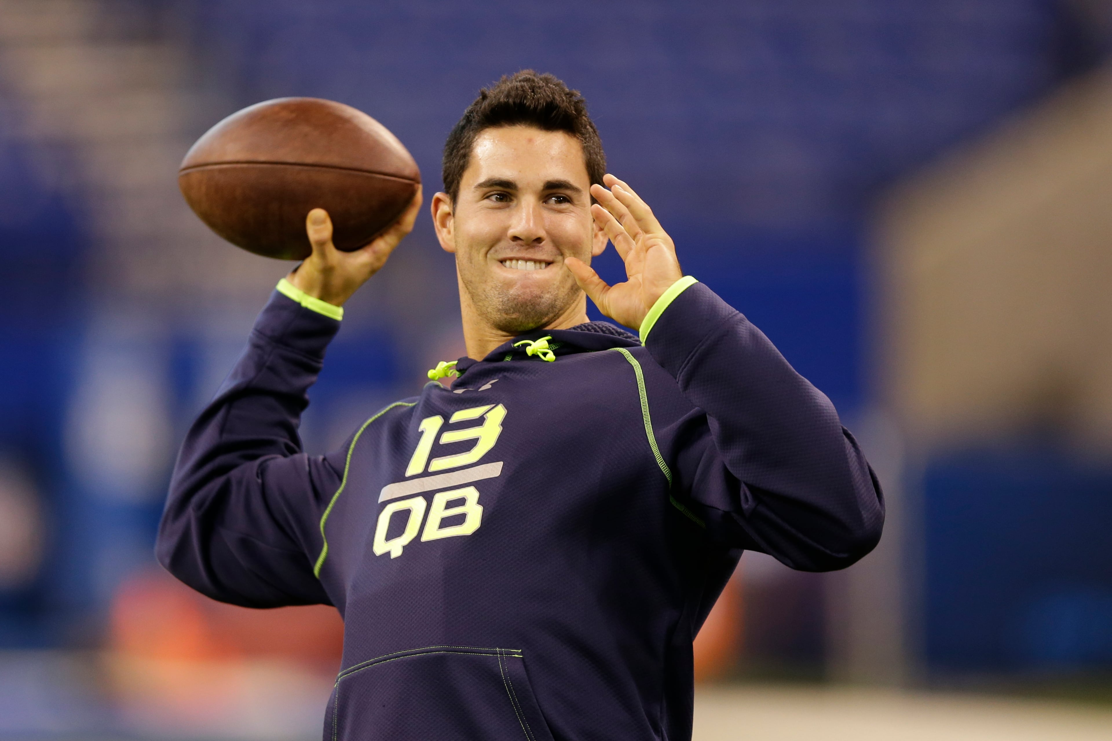 Georgia quarterback Aaron Murray throws during a drill at the NFL football scouting combine in Indianapolis, Sunday, Feb. 23, 2014. (AP Photo/Michael Conroy)