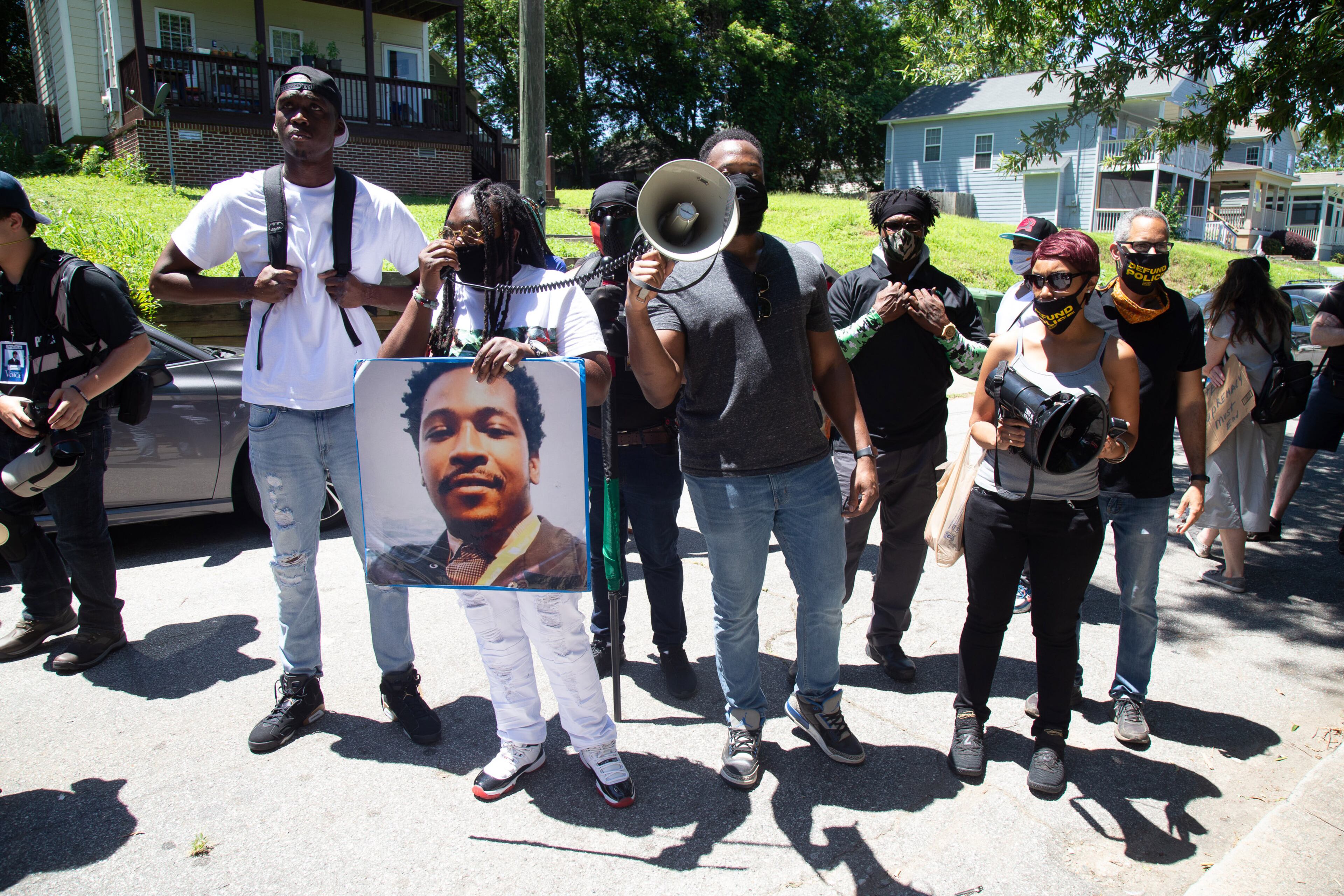 Speakers talk to the crowd before heading or the Wendy's on University Avenue during the 'Take BacktheWendy's' March & Rally in Atlanta on Saturday, July 11, 2020. The march started at the Community Movement Builders community house and ended at the Wendy's. STEVE SCHAEFER FOR THE ATLANTA JOURNAL-CONSTITUTION