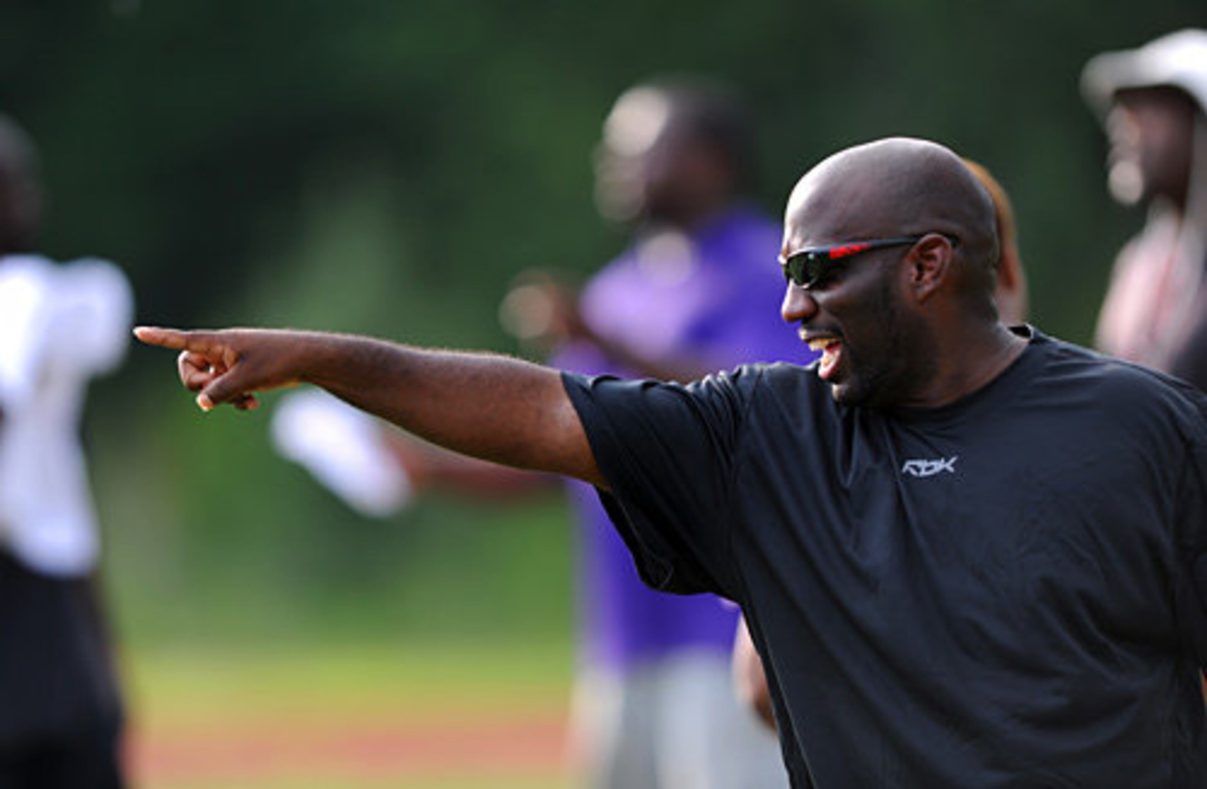 Miller Grove head coach Damien Wimes gives instruction on the field.