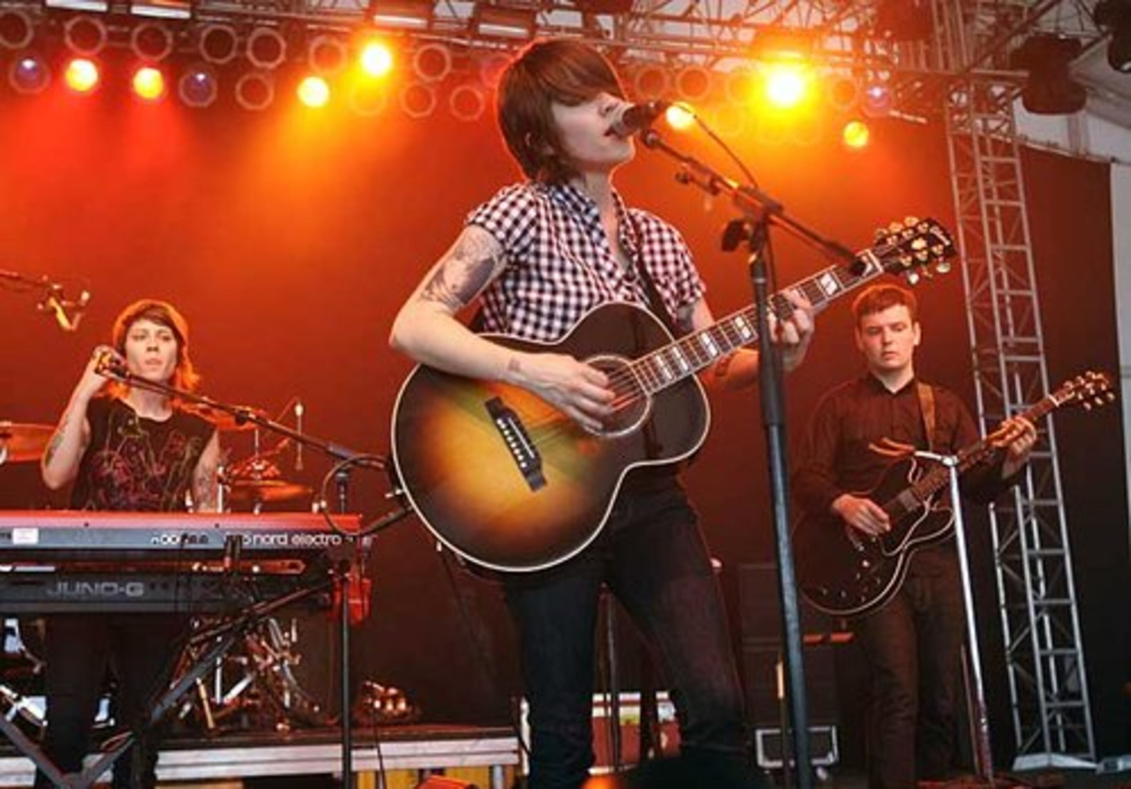 Twins Tegan Quinn, left, and Sara Quinn, center, of the band Tegan and Sara perform. They are scheduled to be part of the True Colors show at Chastain Park on Monday night.