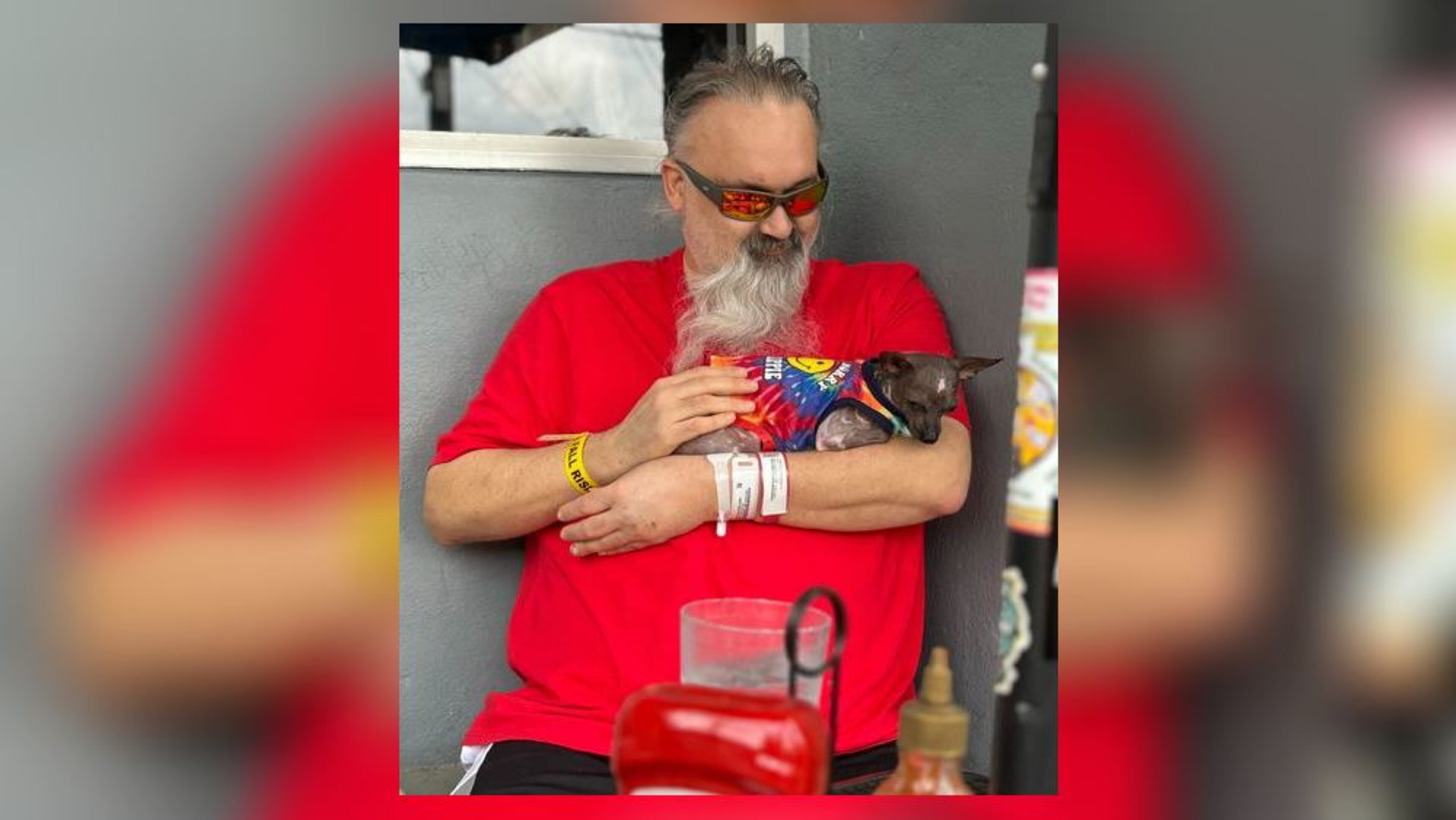 Matt Pruett is seen Monday evening with his dog Chupacabra after he was released from the hospital.