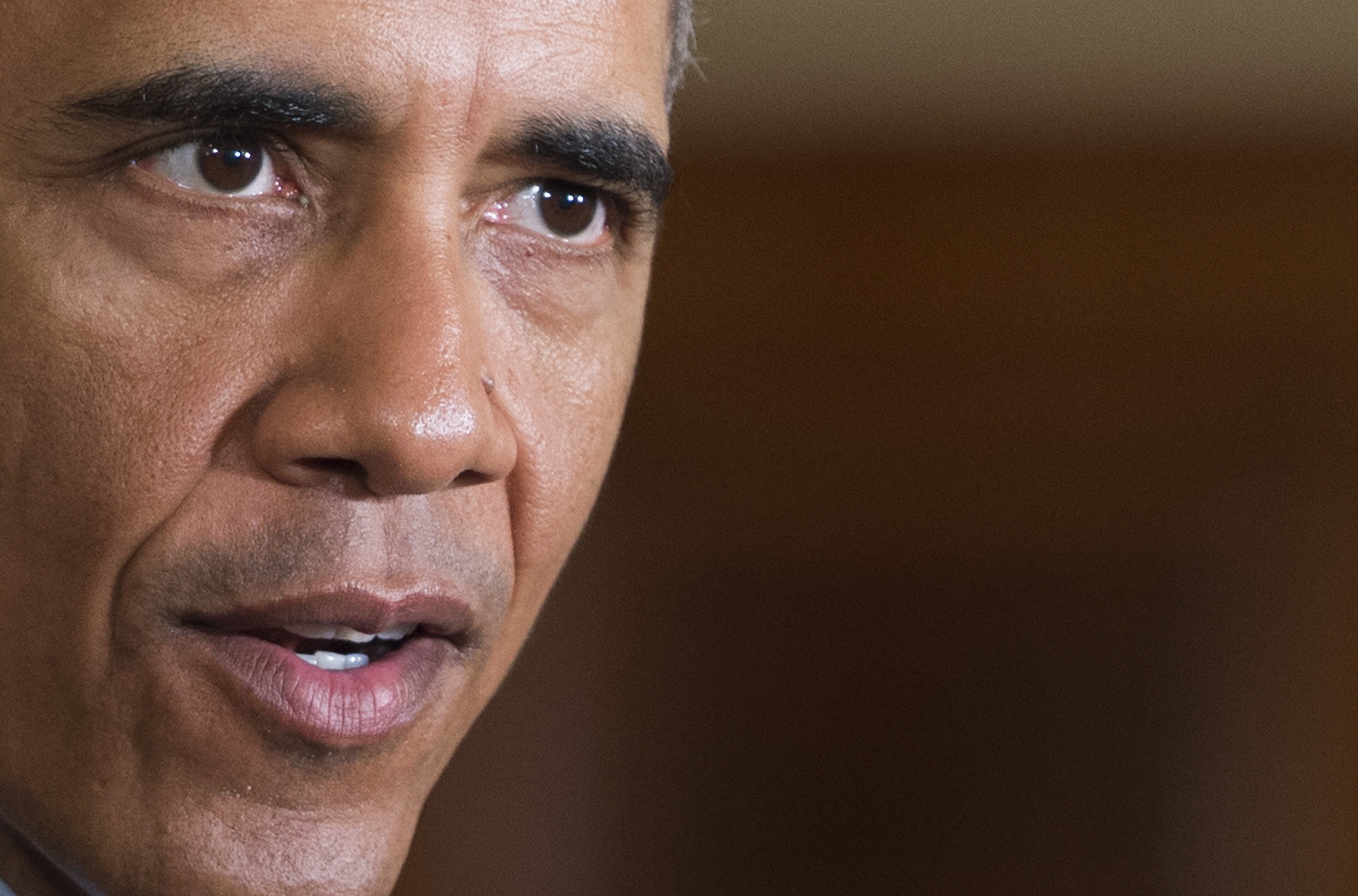 US President Barack Obama delivers remarks at a Clean Power Plan event at the White House in Washington, DC, August 3, 2015. President Barack Obama described climate change as one of the key challenges of our time Monday as he announced the first ever limits on US power plant emissions. As a step to try to adapt, Obama announced power plant owners must cut carbon dioxide emissions by 32 percent from 2005 levels by 2030. AFP PHOTO/JIM WATSON (Photo credit should read JIM WATSON/AFP/Getty Images)