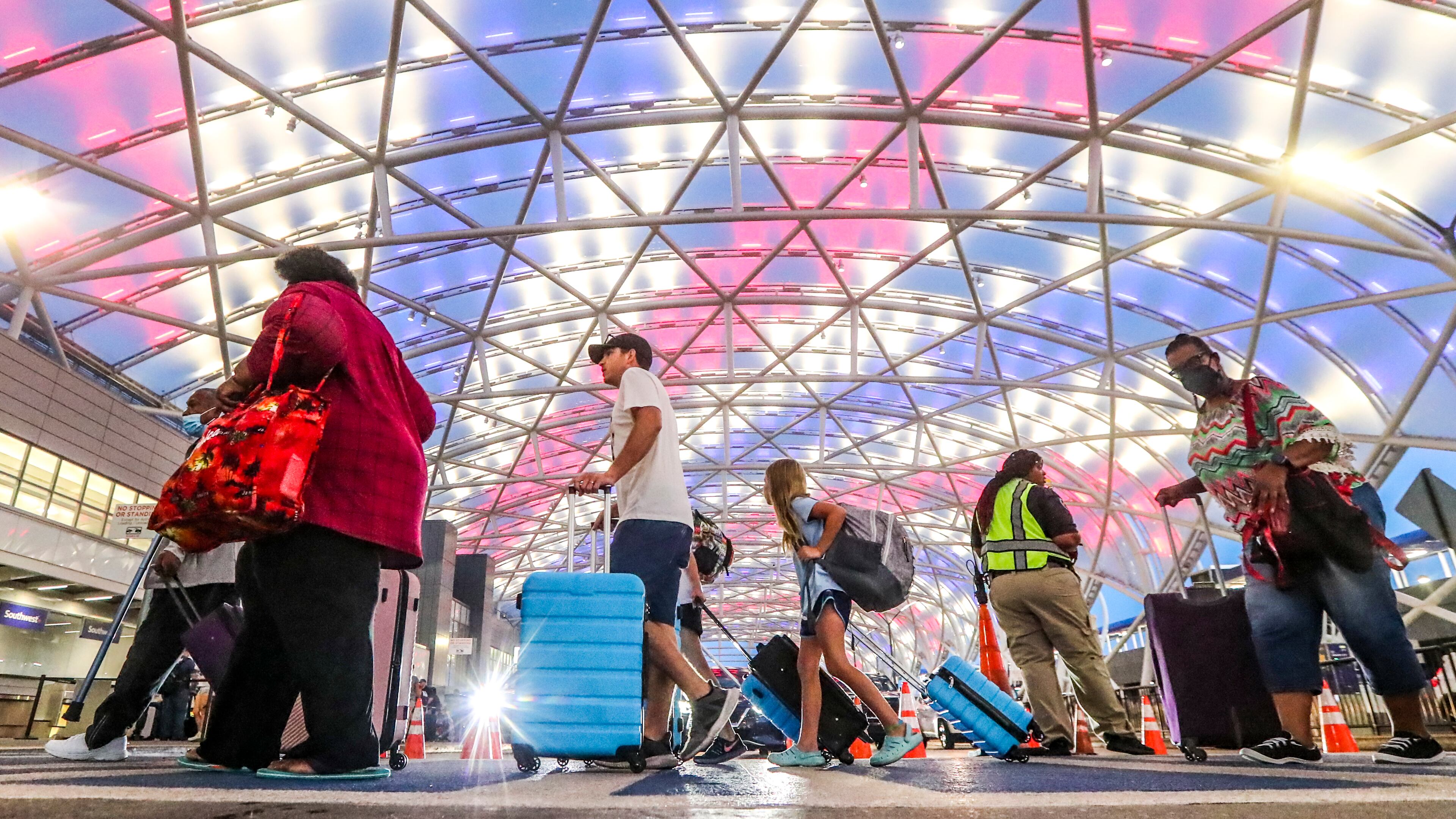 July 5, 2022 Hartsfield-Jackson International Airport: Airline travelers on the North Domestic Terminal made their way through Hartsfield-Jackson International Airport at the domestic terminal on Tuesday, July 5, 2022 after managing through a busy Fourth of July weekend for air travel with storms and cancellations, airlines face the challenge of navigating through the rest of a busy summer. Pilot unions, travelers and Atlanta-based Delta Air Lines had raised concerns about staffing issues and flight disruptions over the holiday weekend. Delta ended up canceling dozens of flights a day throughout the weekend, as did other major carriers as thunderstorms hit Georgia and the East coast. But the Independence Day weekend flight cancellations werenÕt as severe as during Memorial Day weekend and some other nightmare travel days so far this summer. On Friday, the busiest day of the holiday weekend, Delta canceled 117 flights, or 3.9% of scheduled flights according to FlightAware.com. On Saturday, it canceled 81 flights, followed by 54 cancellations on Sunday and 41 cancellations on Monday. Fort Worth, Texas-based American Airlines and Delta have had the worst cancellation rates in the U.S. airline industry in recent weeks, according to FlightAware.com data. (John Spink / John.Spink@ajc.com)