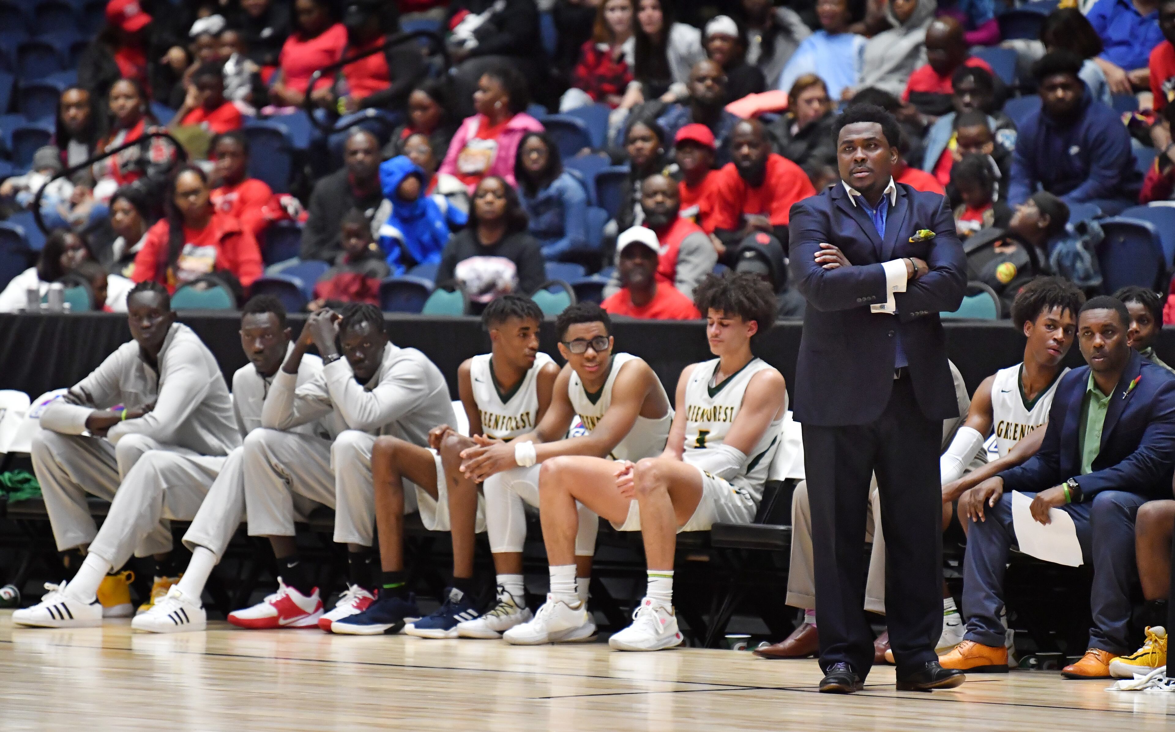 Greenforest head coach Edward Ravenel and players react near the end of the game. St. Francis won 76-55. (Hyosub Shin / Hyosub.Shin@ajc.com)