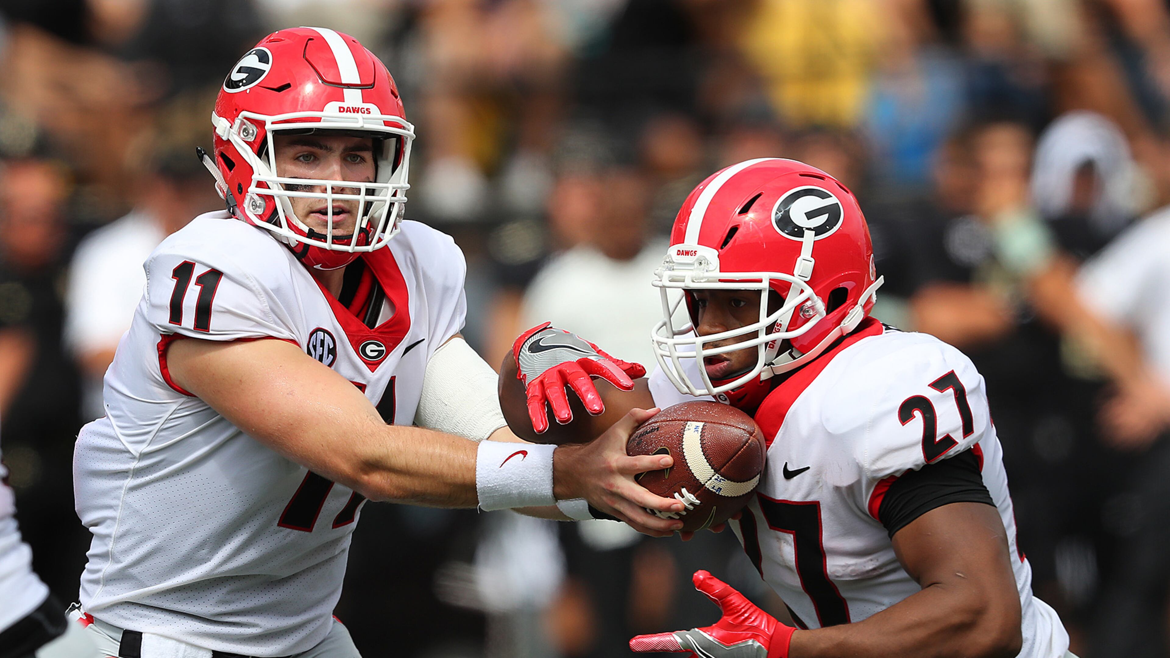 Georgia quarterback Jake Fromm hands off to tailback Nick Chubb for a touchdown run to take a 21-0 lead over Vanderbilt during the second quarter Saturday in Nashville. (Curtis Compton/ccompton@ajc.com)