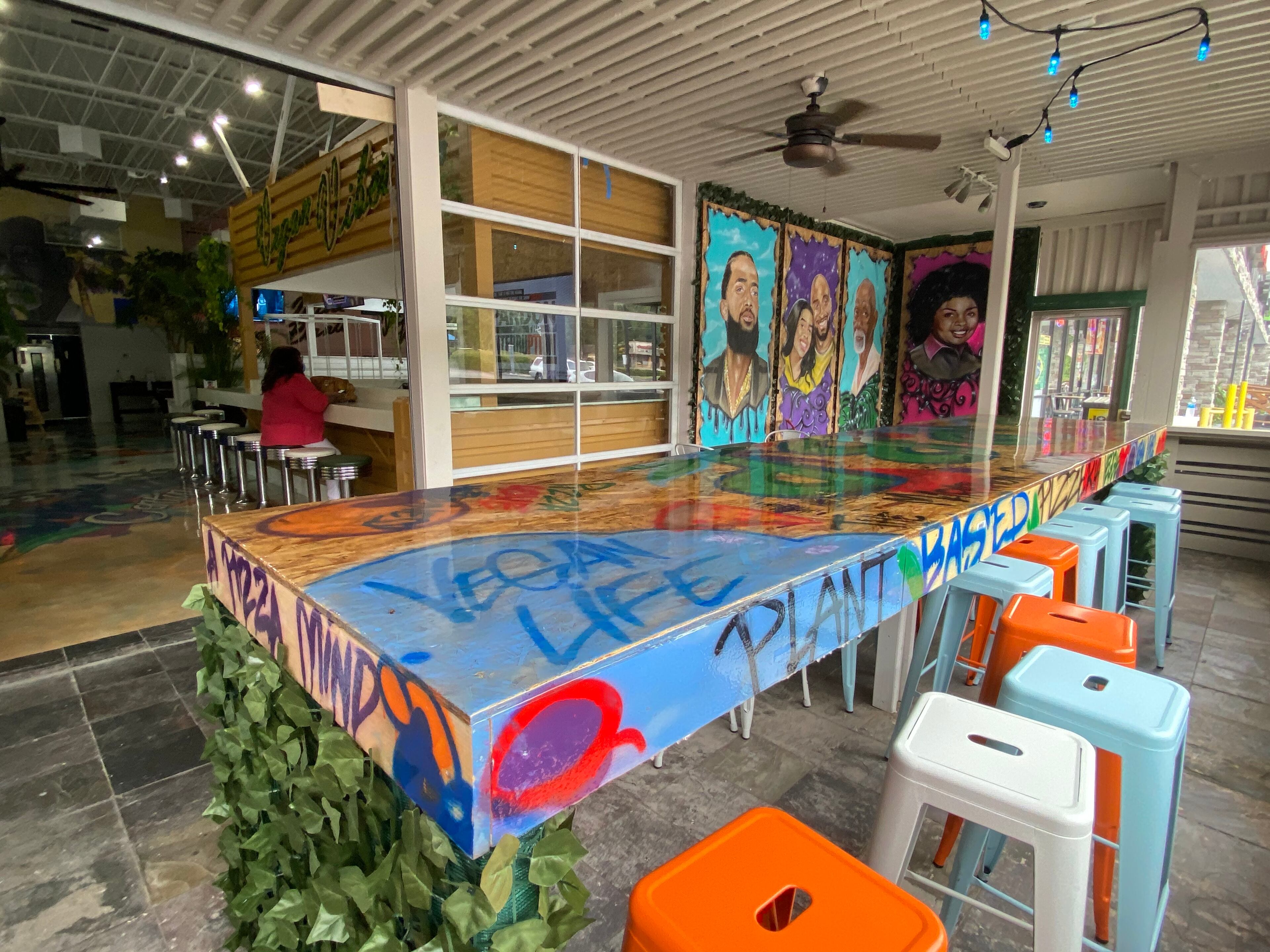 Plant-Based Pizzeria & More is located in a space formerly occupied by a nightclub. Owner Paul Jordan remodeled and brightened the expansive space, which includes a screened patio. Ligaya Figueras/ligaya.figueras@ajc.com