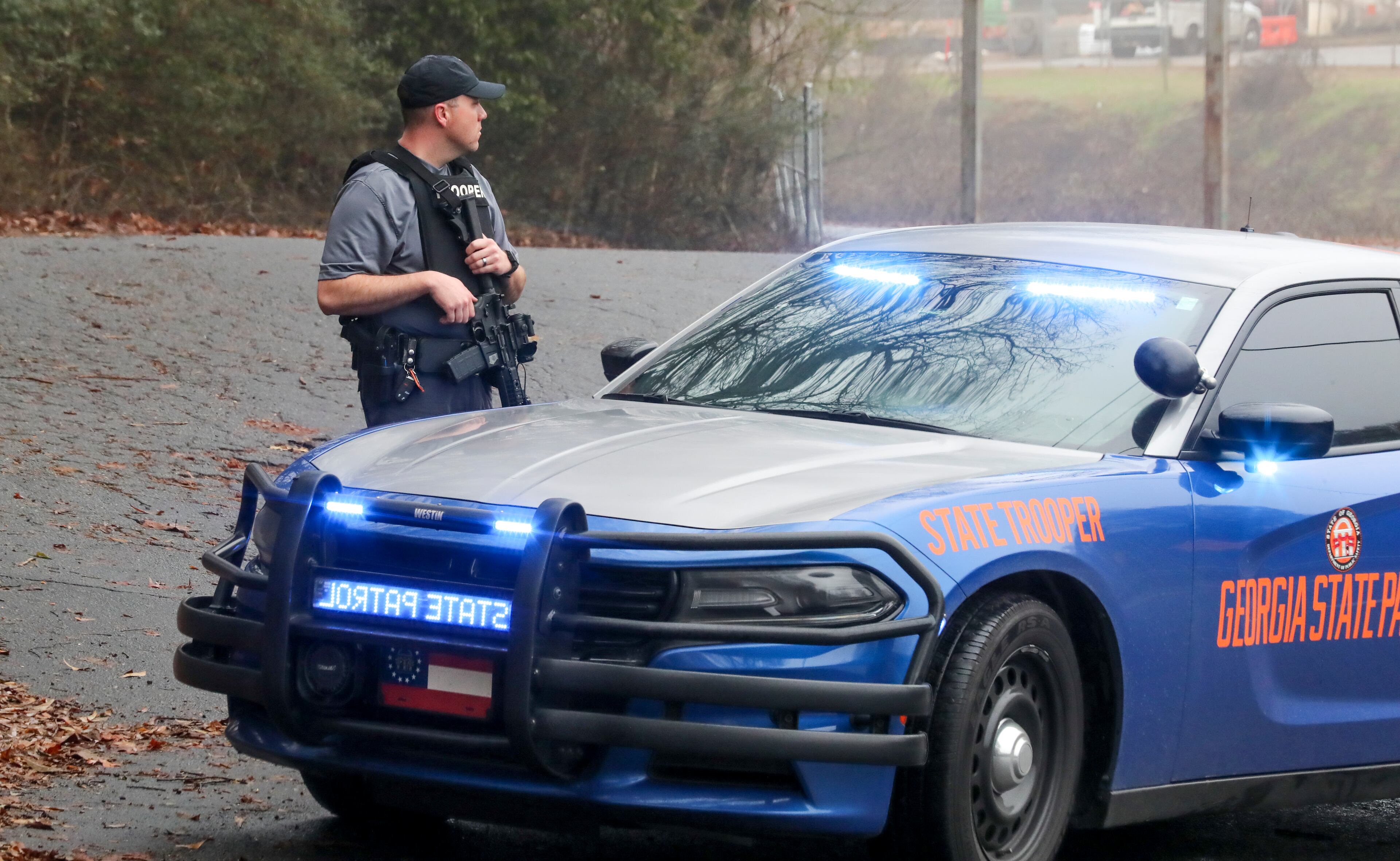 January 18, 2023 ATLANTA: Troopers on Key Road. Georgia state troopers helping conduct a Òclearing operationÓ at the site of AtlantaÕs planned public safety training center exchanged gunfire with a protester Wednesday morning, Jan. 18, 2023 leaving the protester dead and one trooper wounded, according to the Georgia Bureau of Investigation. The purported protester, who was accused of firing first, was believed to be a male. His identity was not immediately released. The wounded trooper also was not identified. He was in surgery around lunchtime Wednesday and in stable condition, Georgia State Patrol Col. Chris Wright said during a brief press conference outside Grady Memorial Hospital. Few other details about the incident near Constitution Road, just south of the proposed training center site in southwestern DeKalb, have been released. Law enforcement was out en masse at nearby Gresham Park and along Key Road to the north. (John Spink / John.Spink@ajc.com)