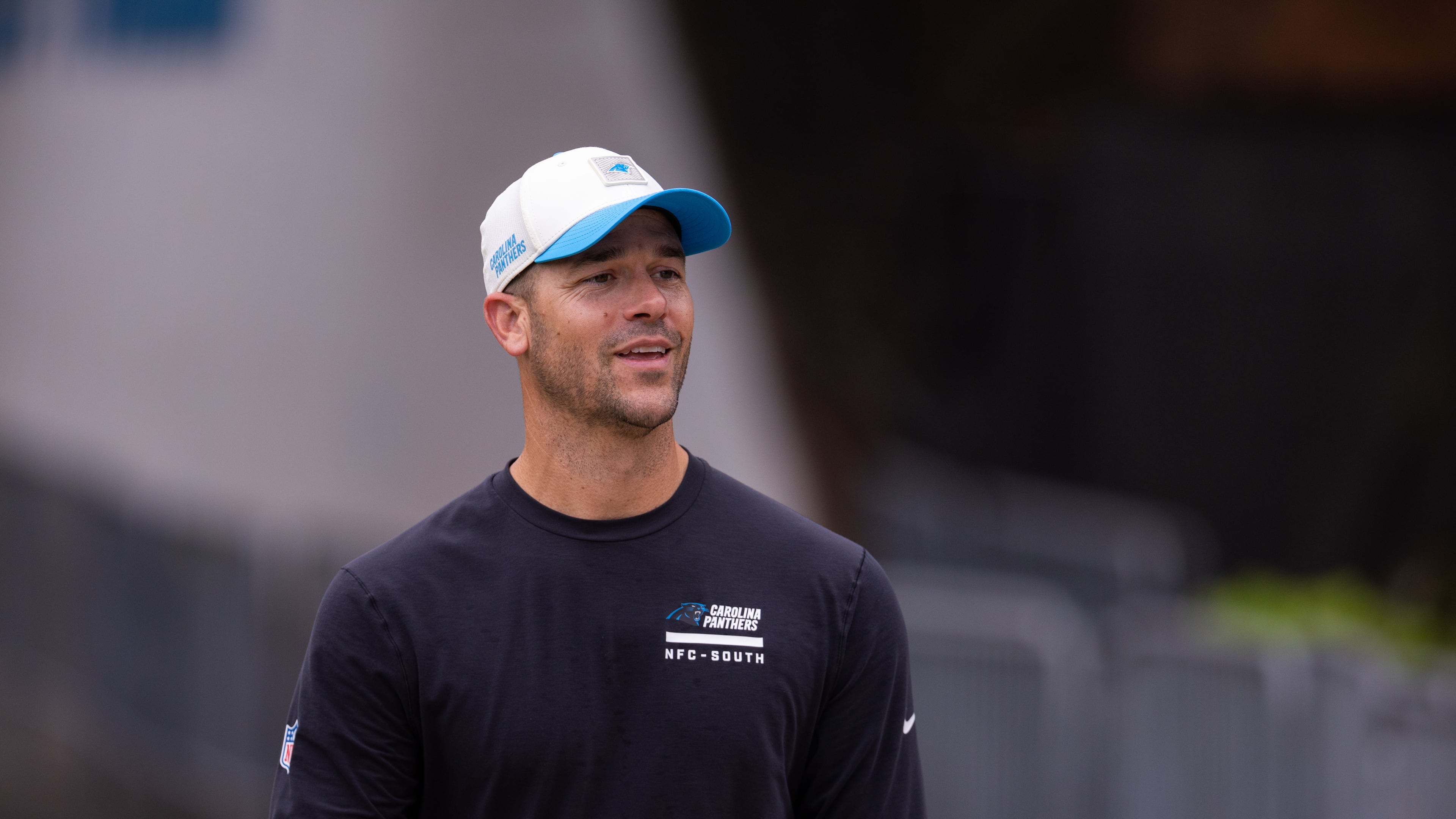 Carolina Panthers head coach Dave Canales walks up to the field forc} the NFL football team's training camp Friday, July 24, 2026, in Charlotte, N.C. (AP Photo/Scott Kinser)