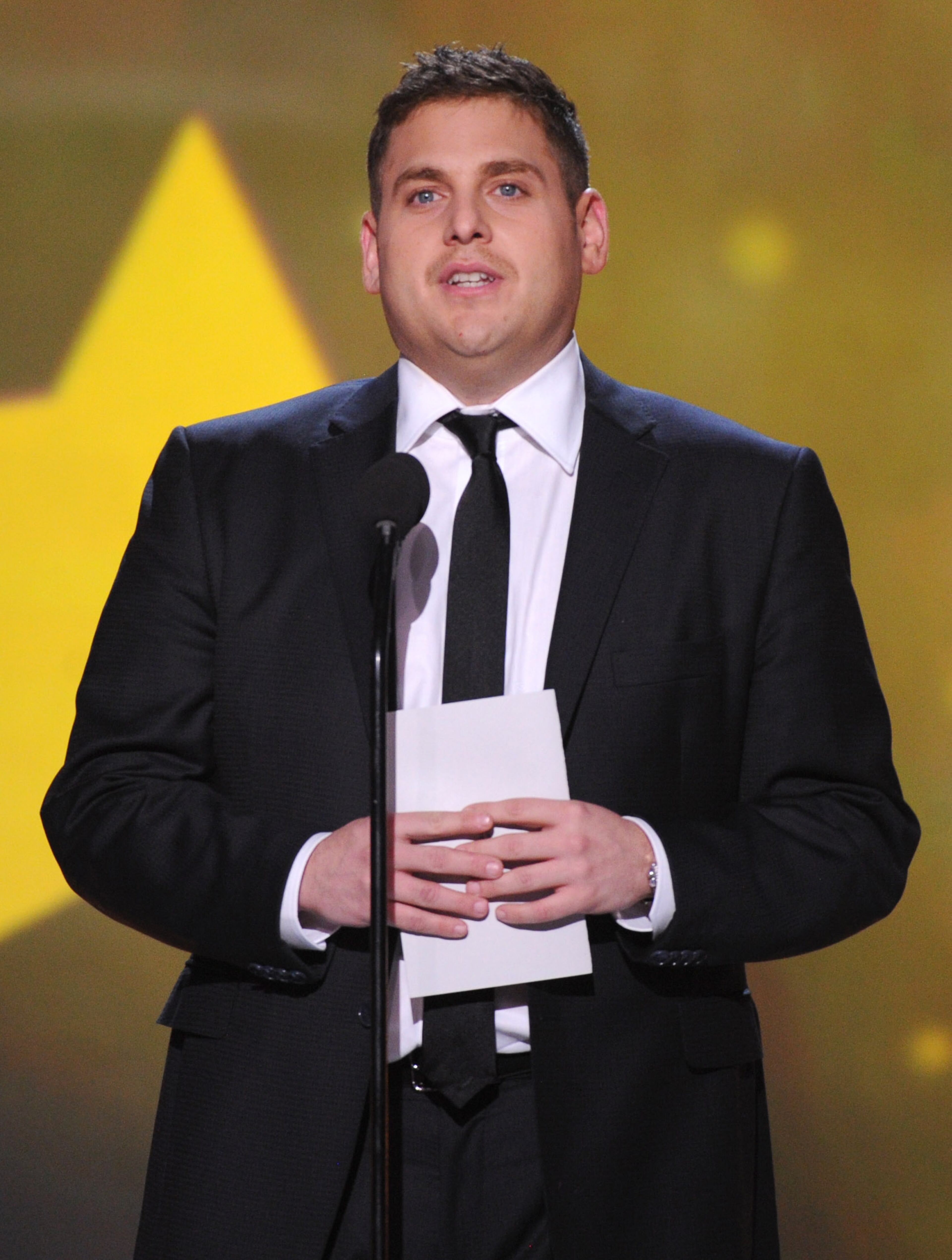 Jonah Hill speaks on stage at the 19th annual Critics' Choice Movie Awards at the Barker Hangar on Thursday, Jan. 16, 2014, in Santa Monica, Calif. (Photo by Frank Micelotta/Invision/AP)