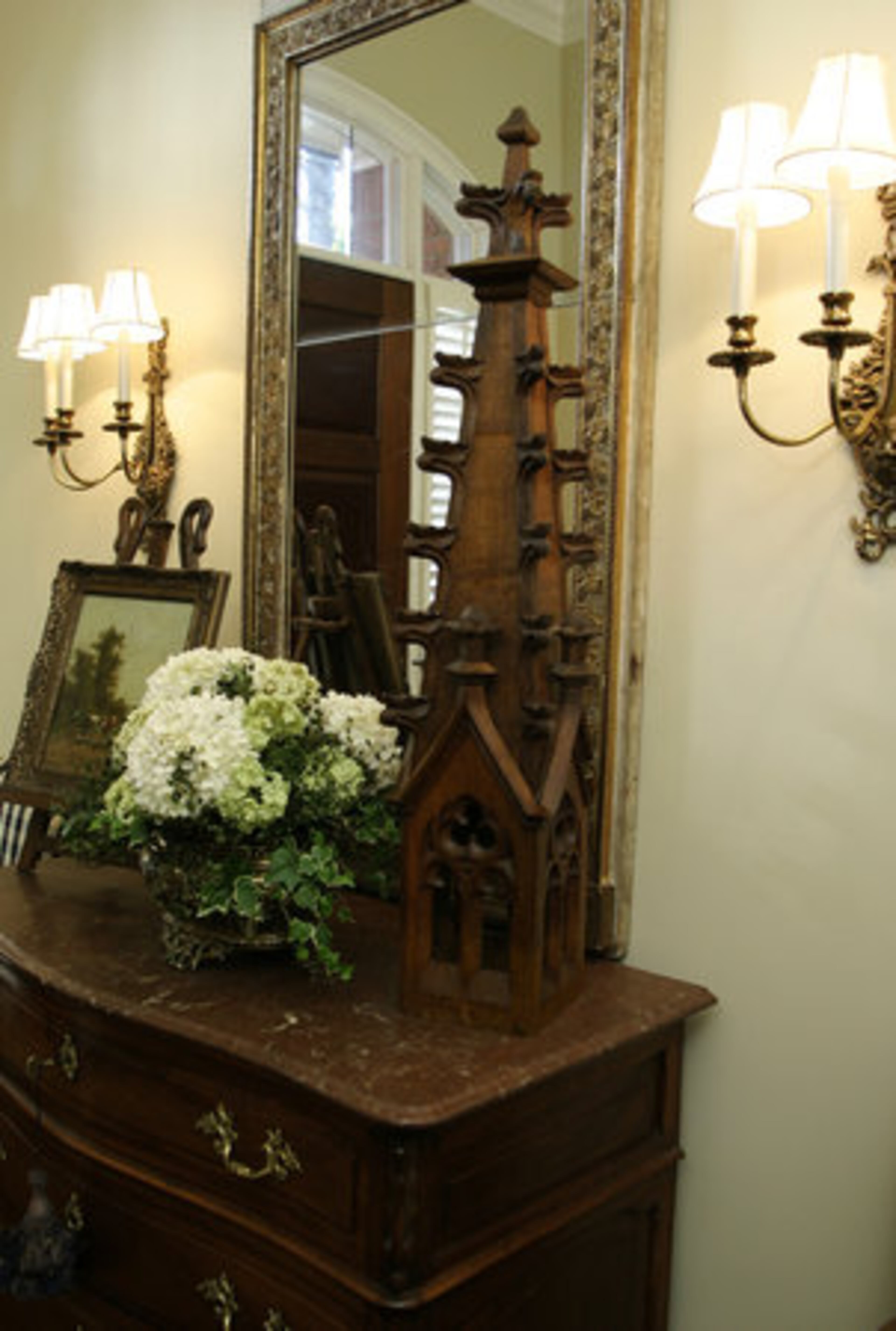 The finial used to decorate the foyer is one of the architectural fragments Martha collects. Her love of antiques has to do with curiosity -- the story, even the legacy, behind the object. Who owned it, where was it, and what was it all like? she wonders. "It's a fragment from something," she says. "The past is gone, but yet that's still with us."