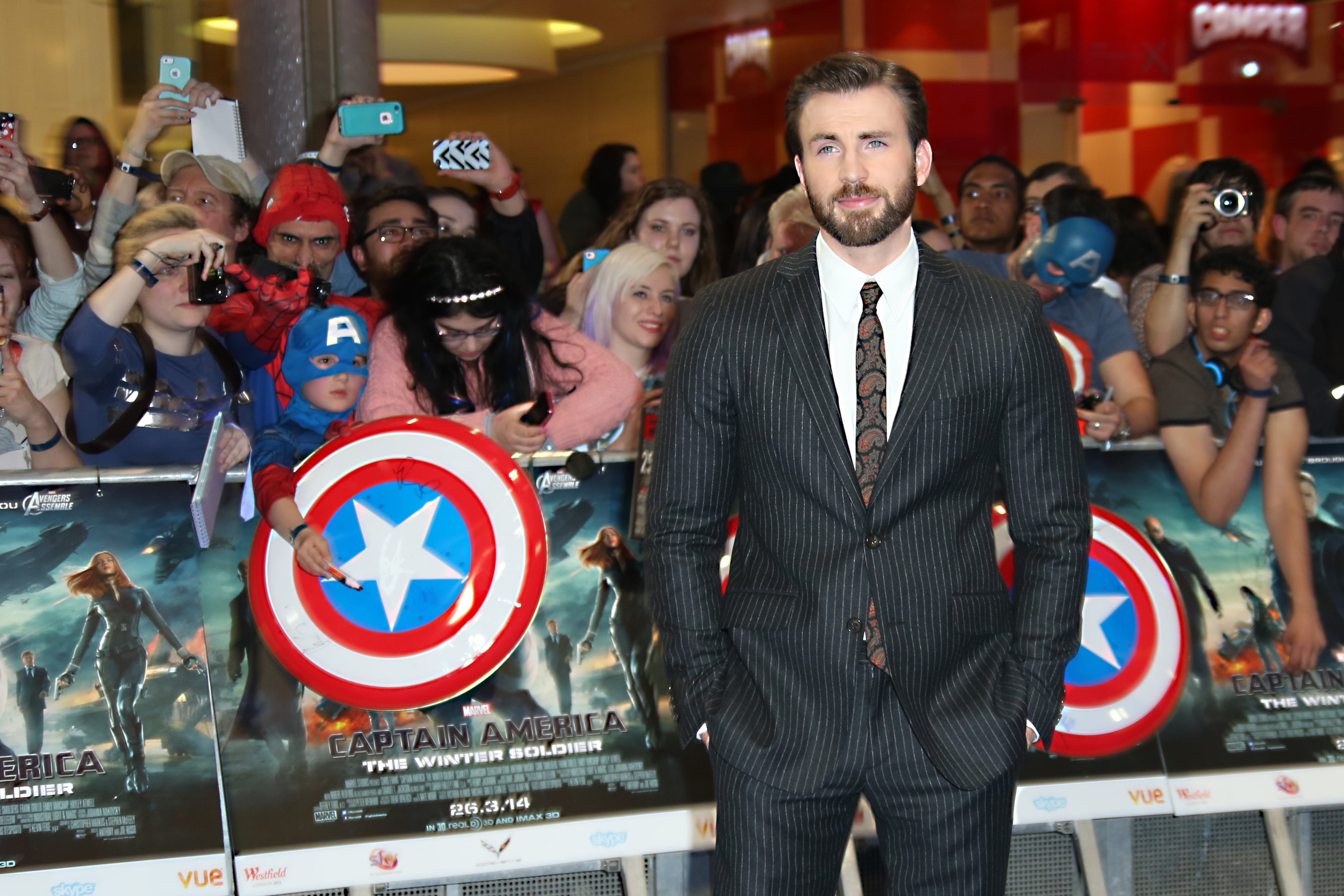Chris Evans poses for photographers as he arrives for the UK premiere of the movie Captain America: The Winter Soldier at the Vue Westfield on Thursday, March 20, 2014 in London. (Photo by Joel Ryan/Invision/AP Images)