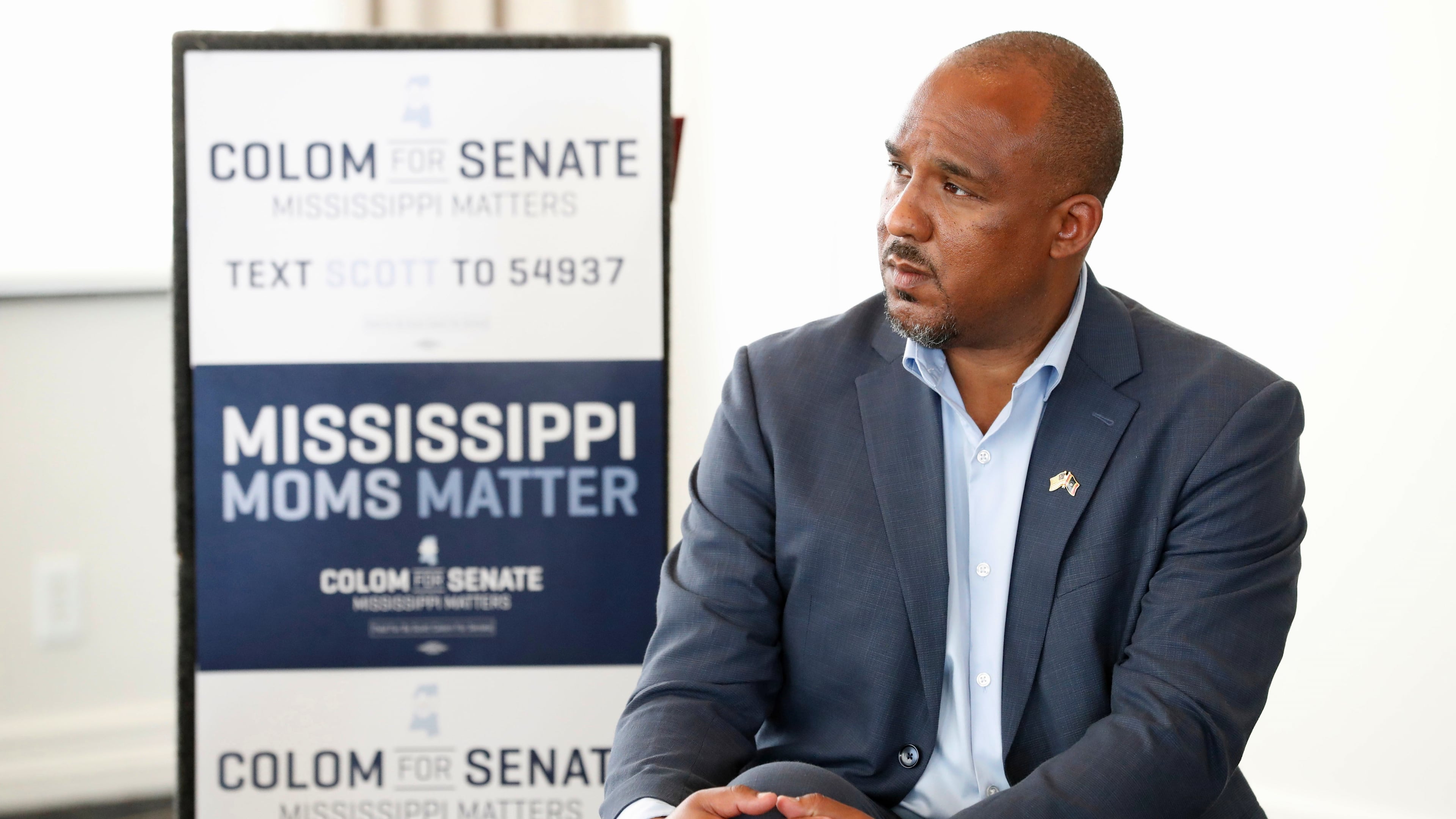 FILE - Mississippi Democratic U.S. Senate candidate Scott Colom listens during a maternal health roundtable at the Capital Club in Jackson, Miss., Aug. 1, 2026. (AP Photo/Sarah Warnock, File)