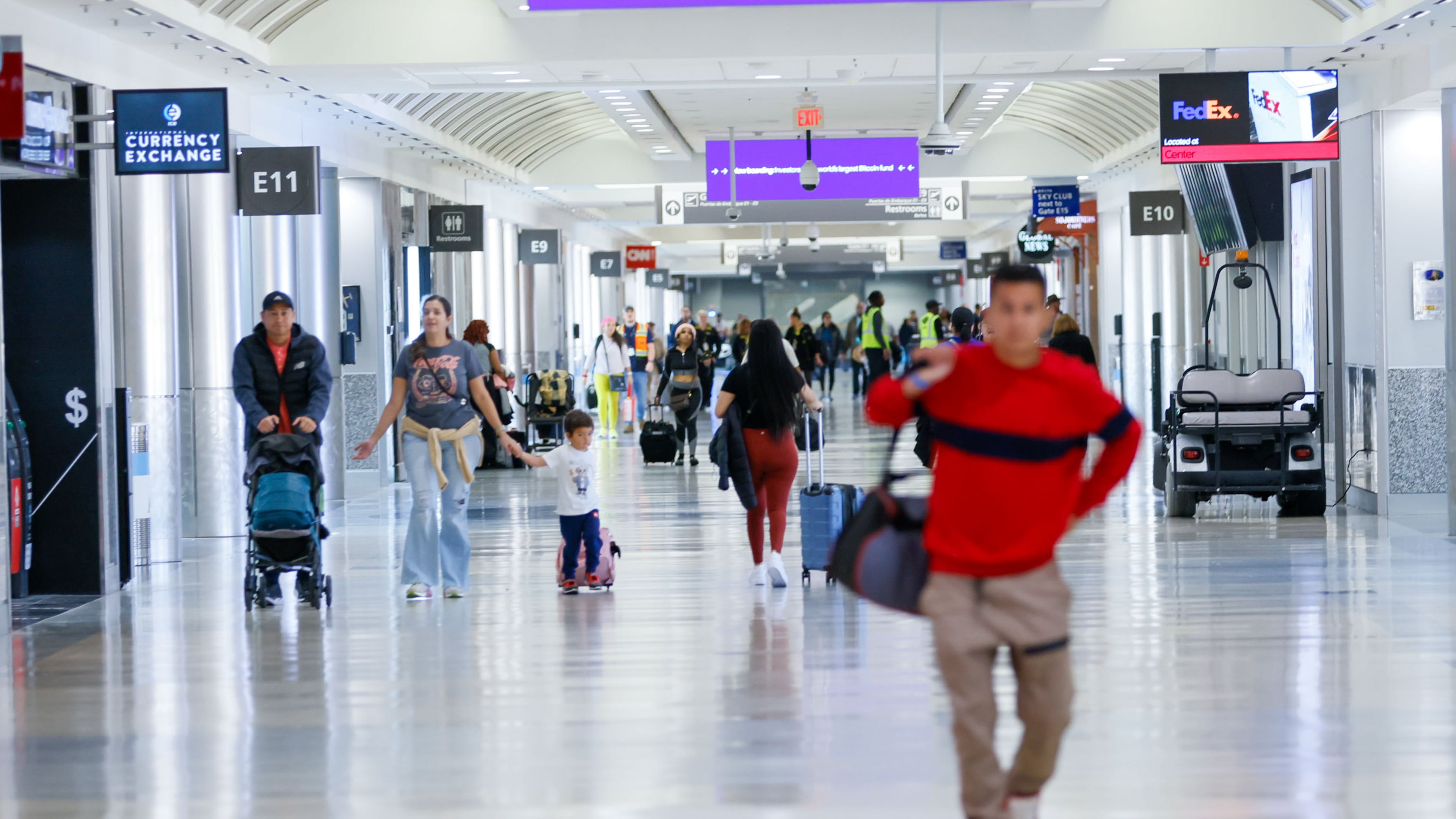 Travelers walk through Concourse E inside the Hartsfield-Jackson Atlanta International Airport. Three new gates have been built off the end of the concourse. (Miguel Martinez/AJC 2023)