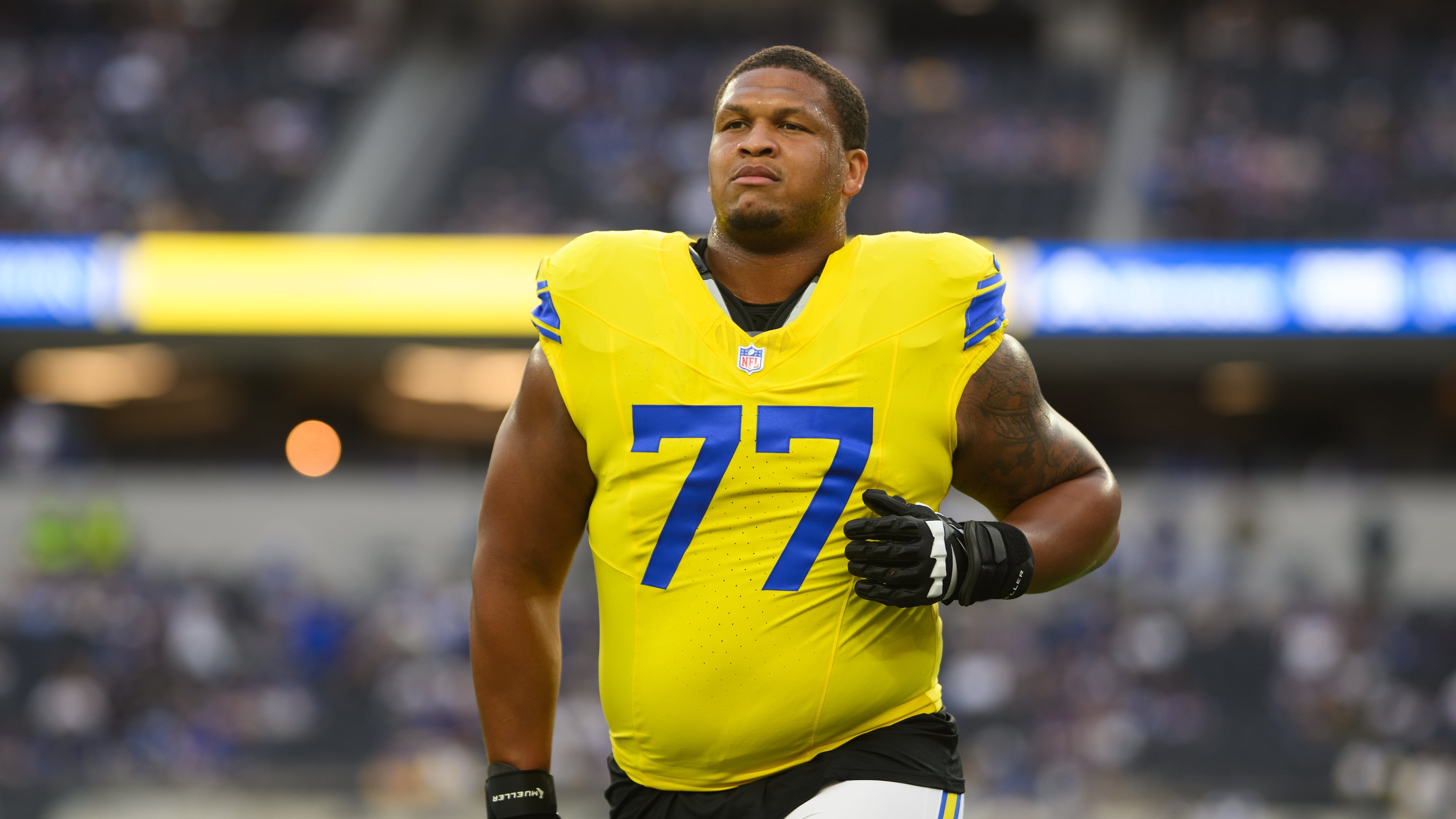 FILE - Los Angeles Rams offensive tackle Alaric Jackson (77) jogs back to the locker room before an NFL football game against the New York Giants in Inglewood, Calif., Sept. 21, 2026. (AP Photo/Kyusung Gong, File)