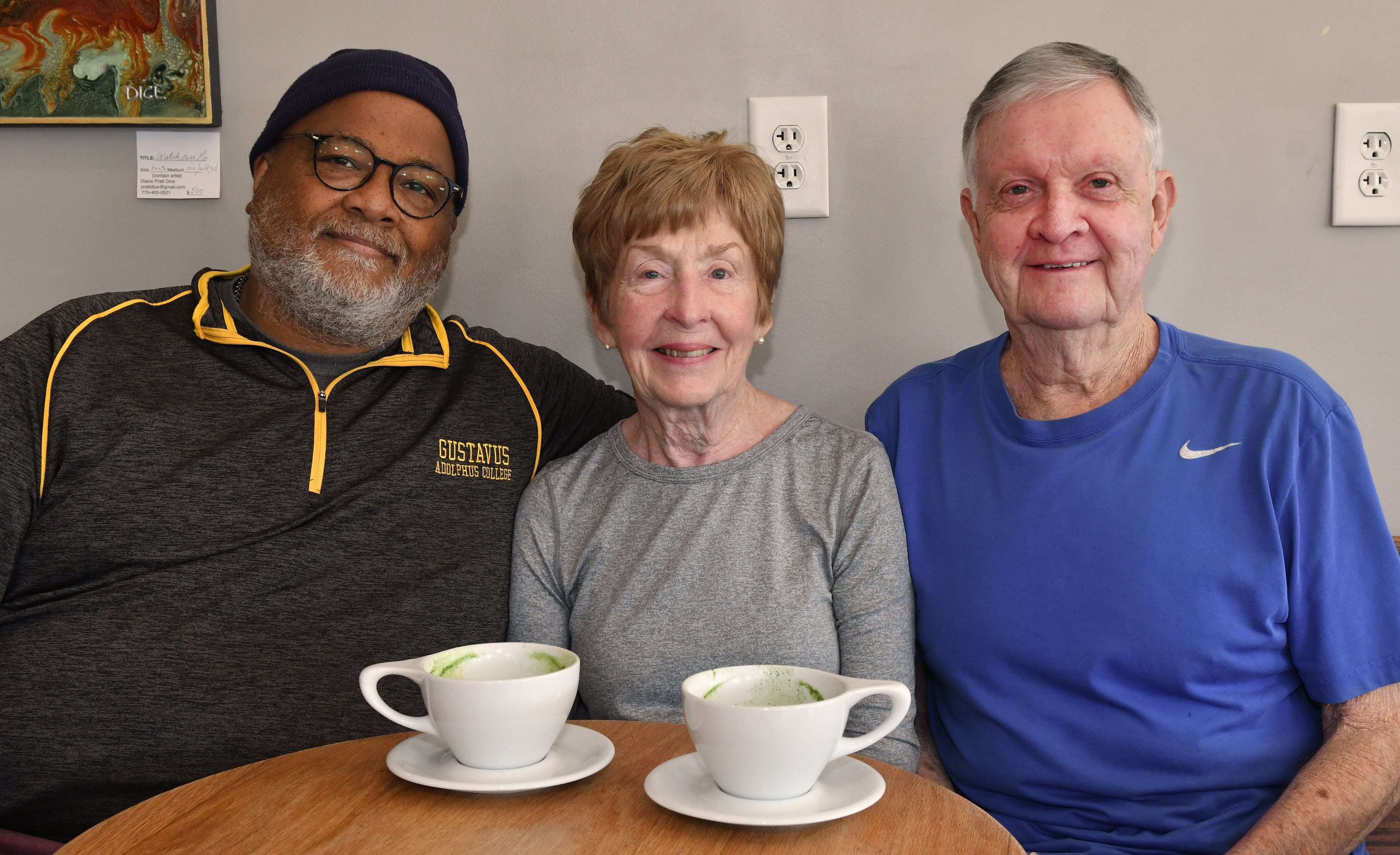 Keith and Martha Cameron are longtime customers at Beans & Butter Coffeehouse in Lawrenceville, where Michael Simmons (left) is the owner. Photo by Chris Hunt for The Atlanta Journal-Constitution