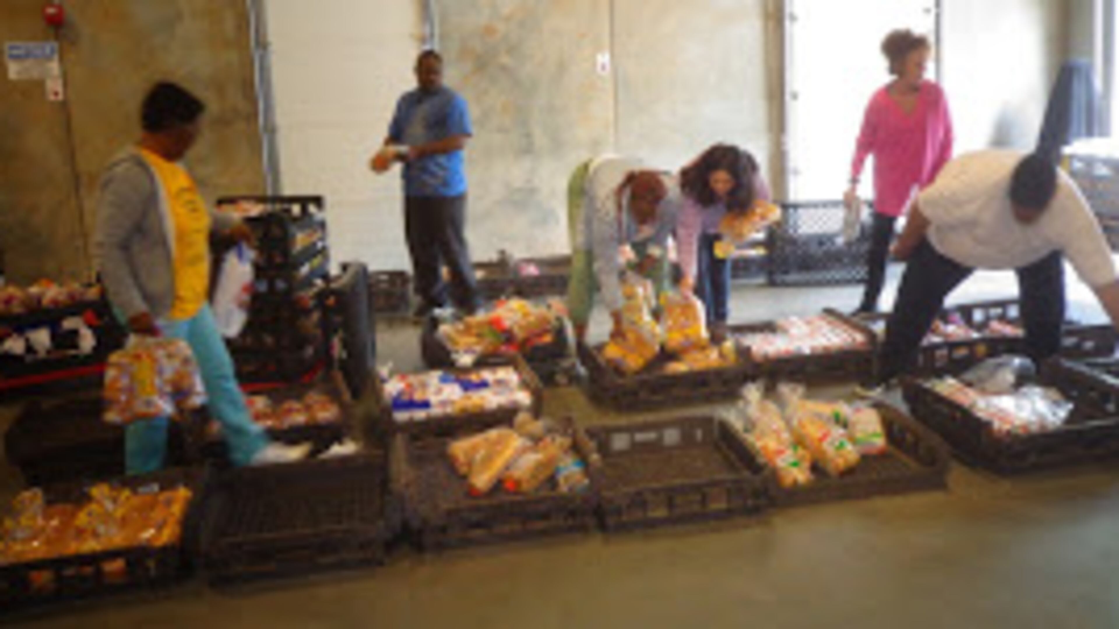 Volunteers help at the food pantry at Daily Bread for All. CONTRIBUTED