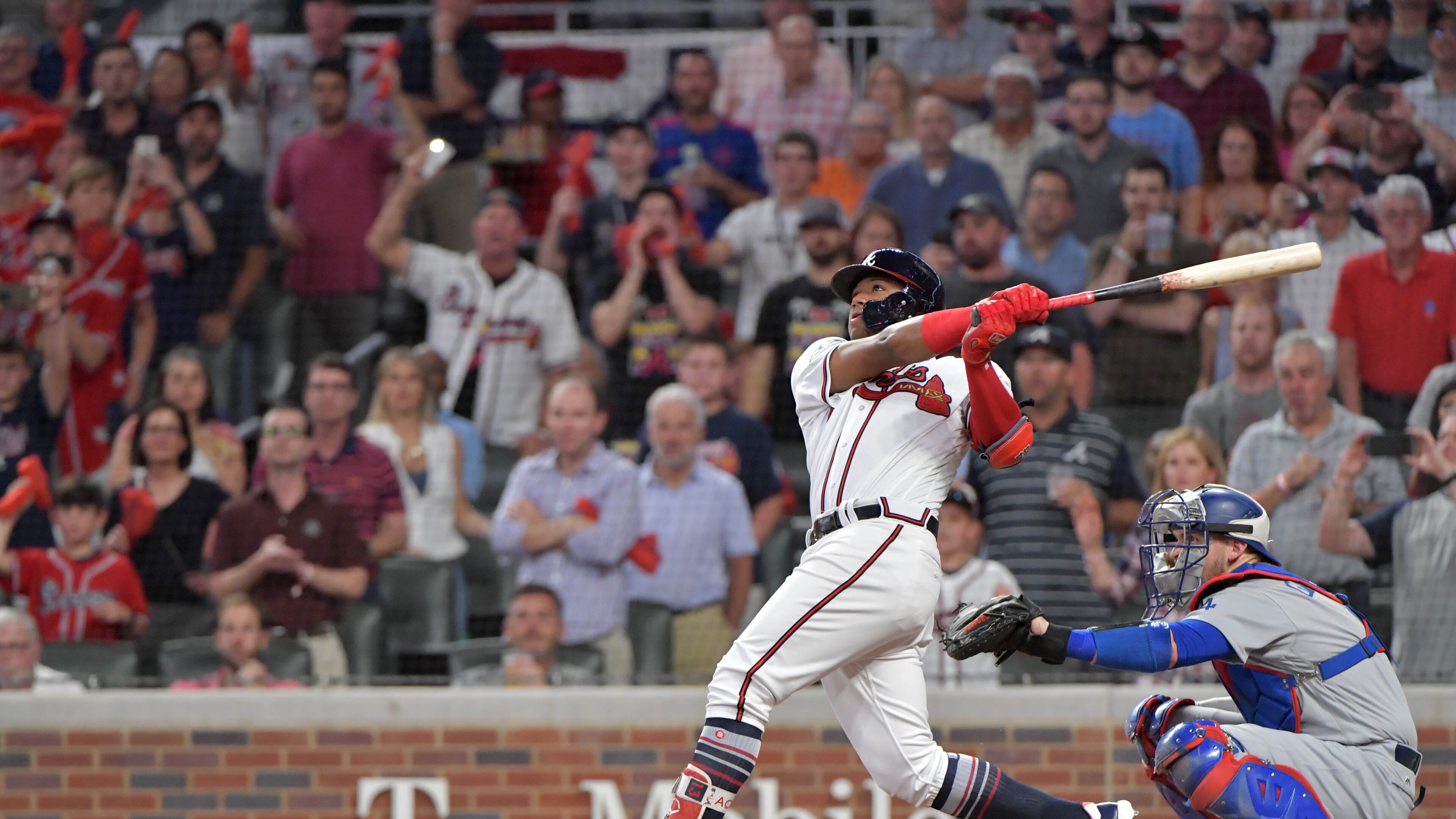 The Braves’ Ronald Acuna hits a grand slam in the second inning of Game 3 of the National League Division Series against the Dodgers.