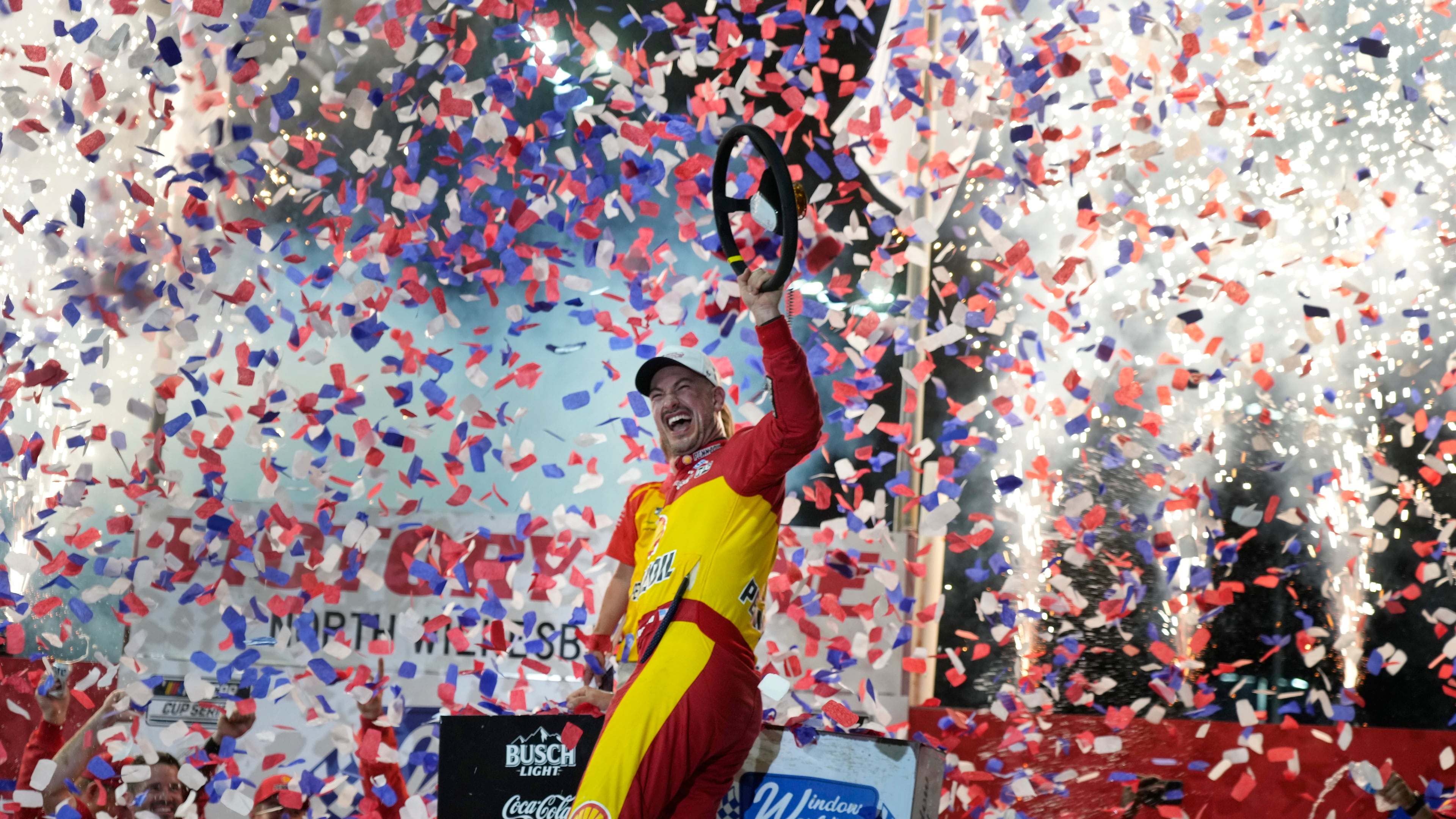 Joey Logano celebrates in Victory Lane after winning a NASCAR Cup Series auto race in North Wilkesboro, N.C., Sunday, July 19, 2026. (AP Photo/Chuck Burton)