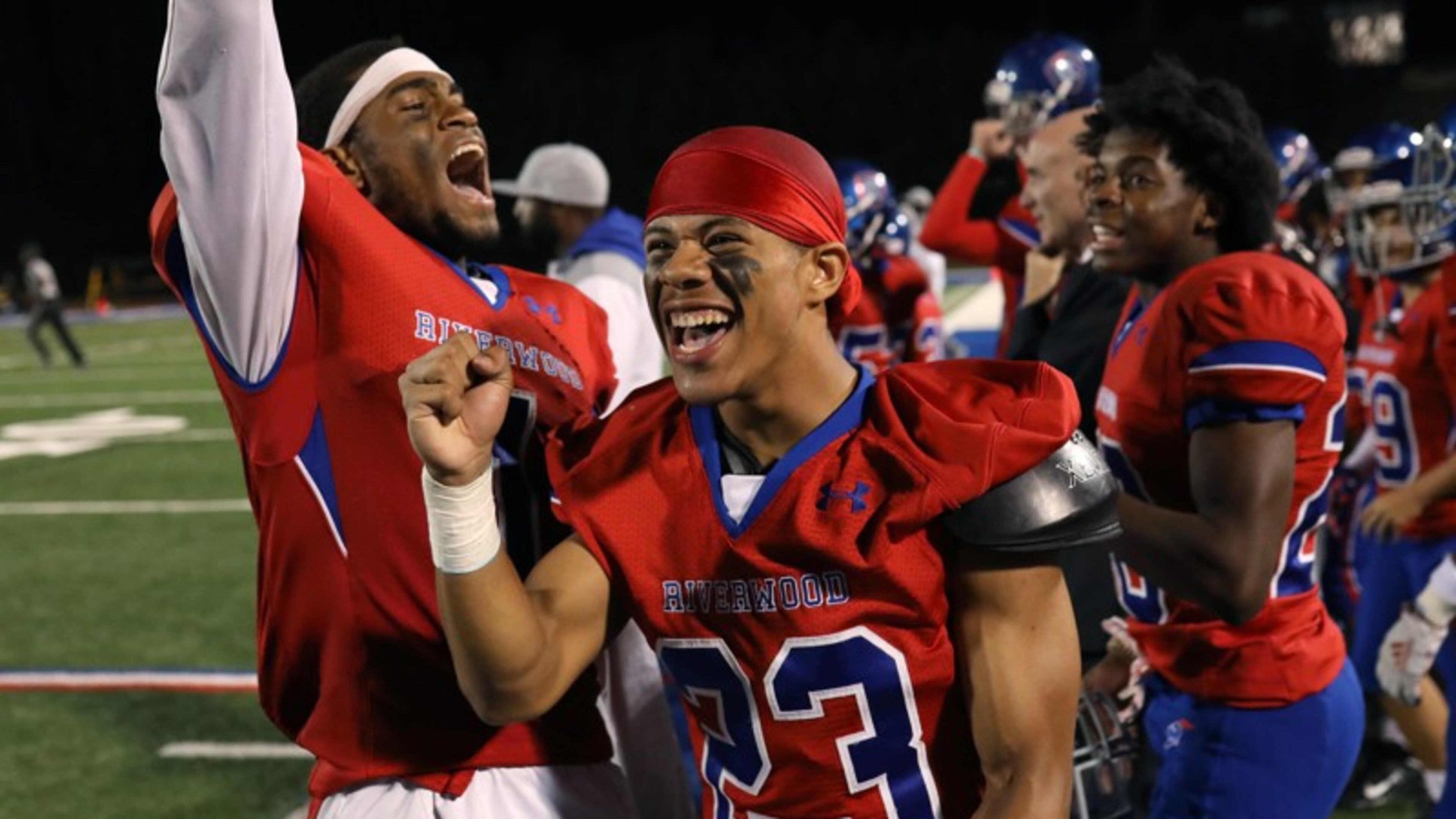 Riverwood wide receivers Austin Simmons (left) and Donovan Logan (23) celebrate after a 21-6 home victory over Carver-Atlanta on Oct. 18, 2019. (Jason Getz/Special)