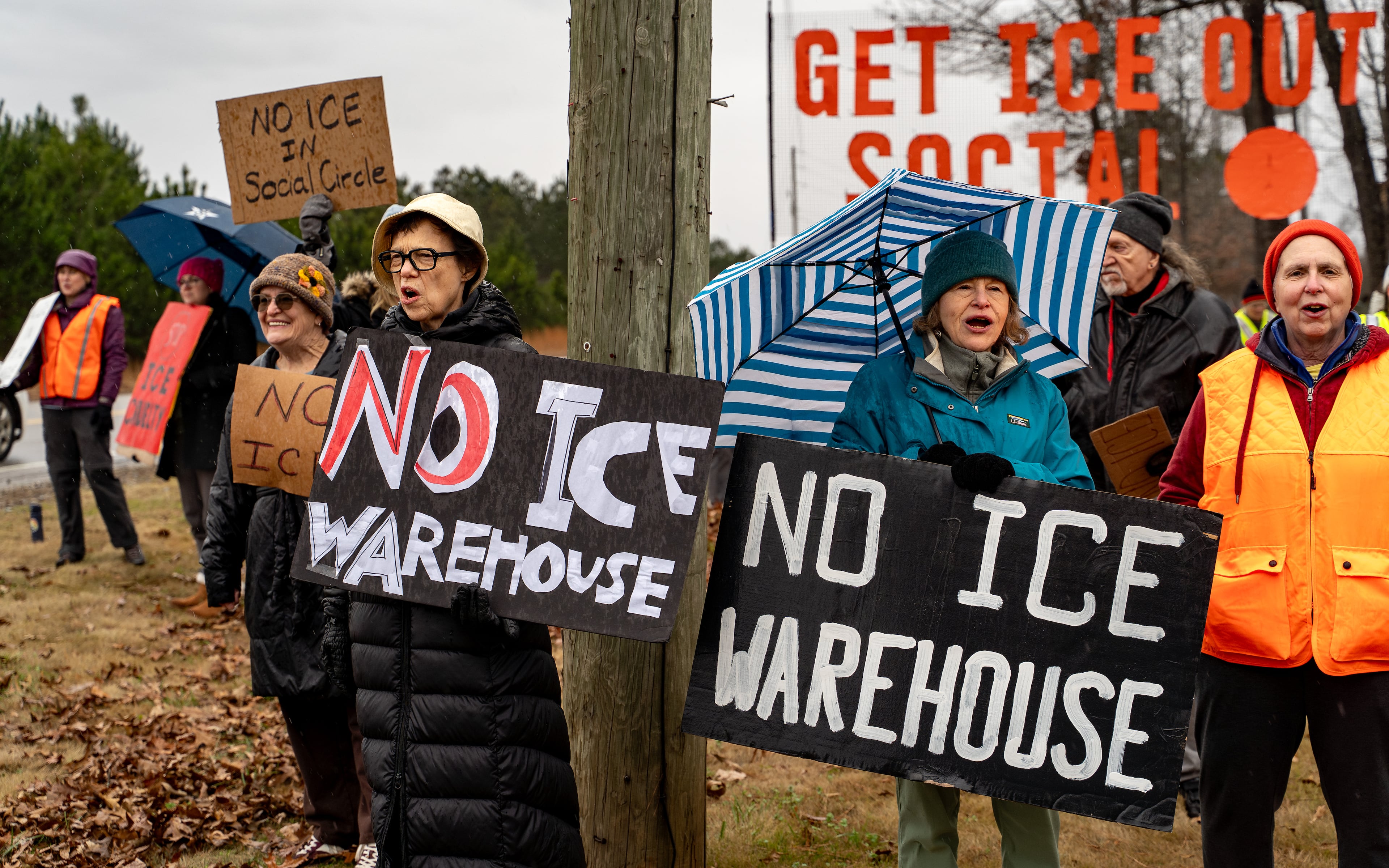 Anti-ICE protesters gather on Social Circle Parkway to voice opposition to a potential Immigration and Customs Enforcement facility on Wednesday, Jan. 14, 2026. (Ben Hendren/AJC)