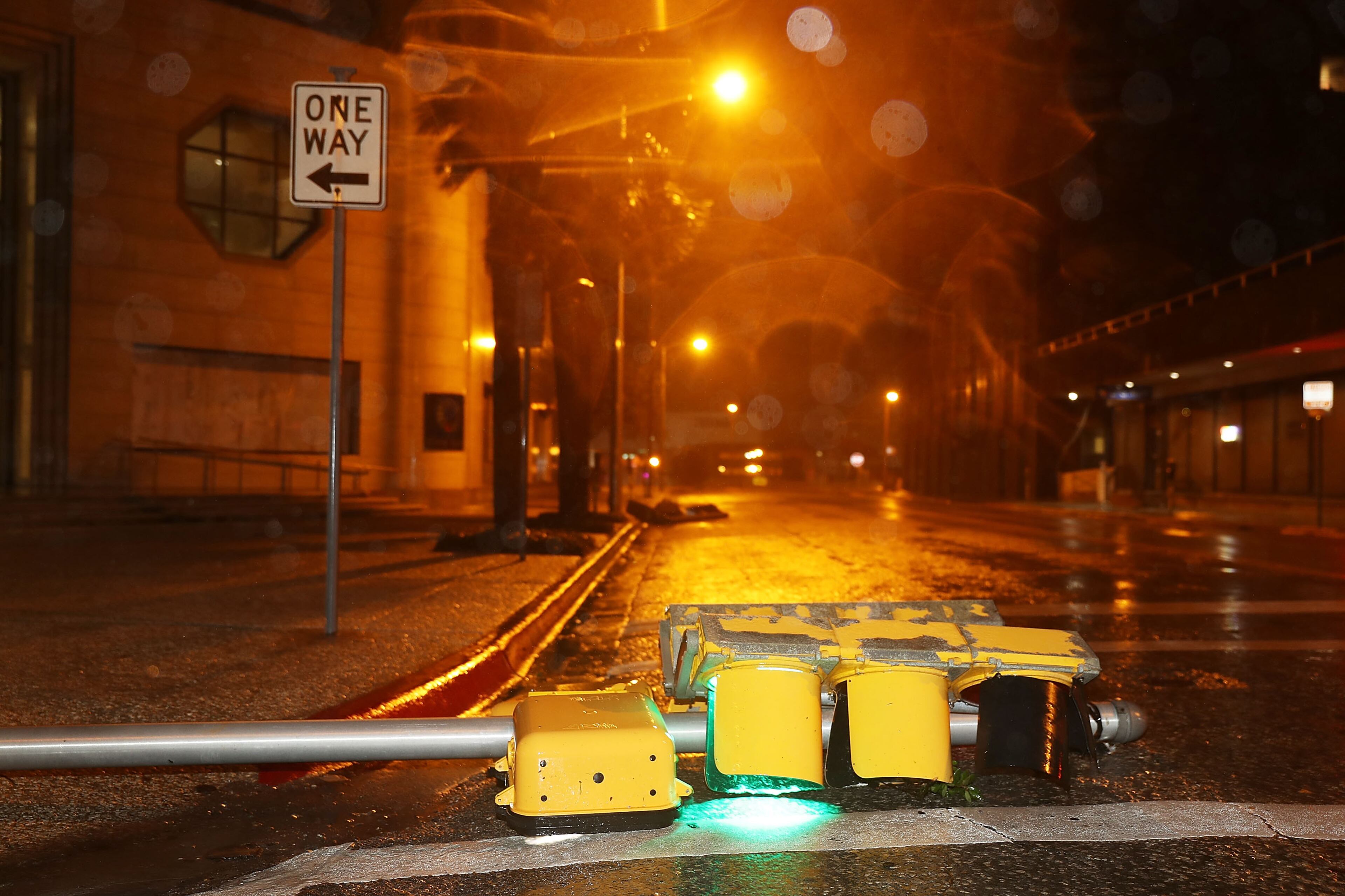 CORPUS CHRISTI, TX - AUGUST 26: A street light lays in the street after being blown over by Hurricane Harvey on August 26, 2017 in Corpus Christi, Texas. Hurricane Harvey had intensified into a hurricane and hit the Texas coast as damage is being assessed. (Photo by Joe Raedle/Getty Images)