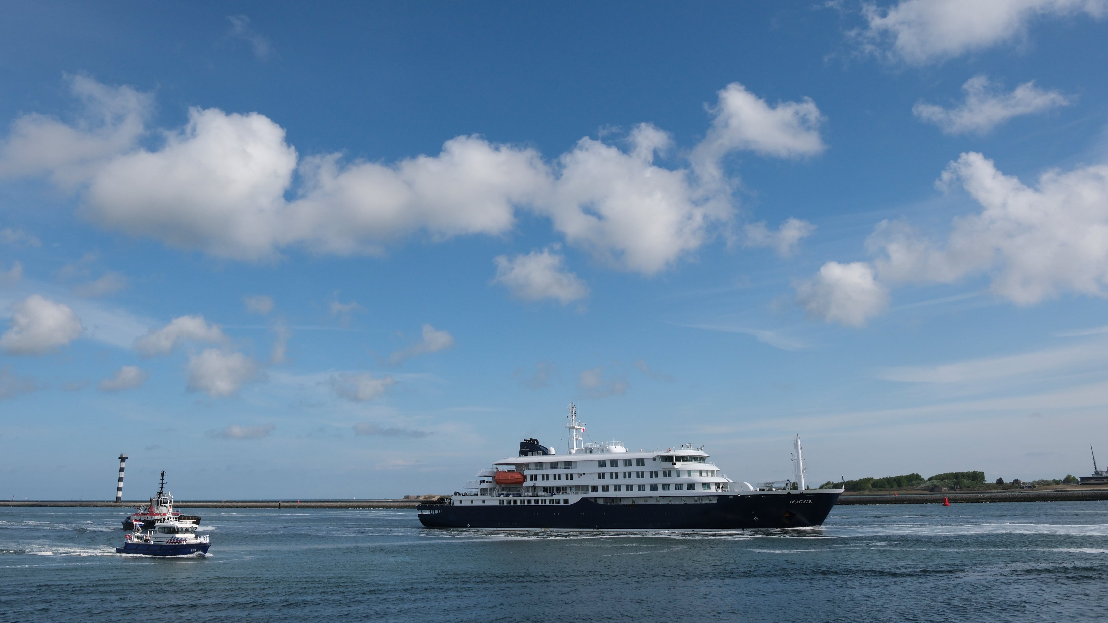 The MV Hondius cruise ship is escorted into the Port of Rotterdam, Netherlands, Monday, May 18, 2026. (AP Photo/Patrick Post)