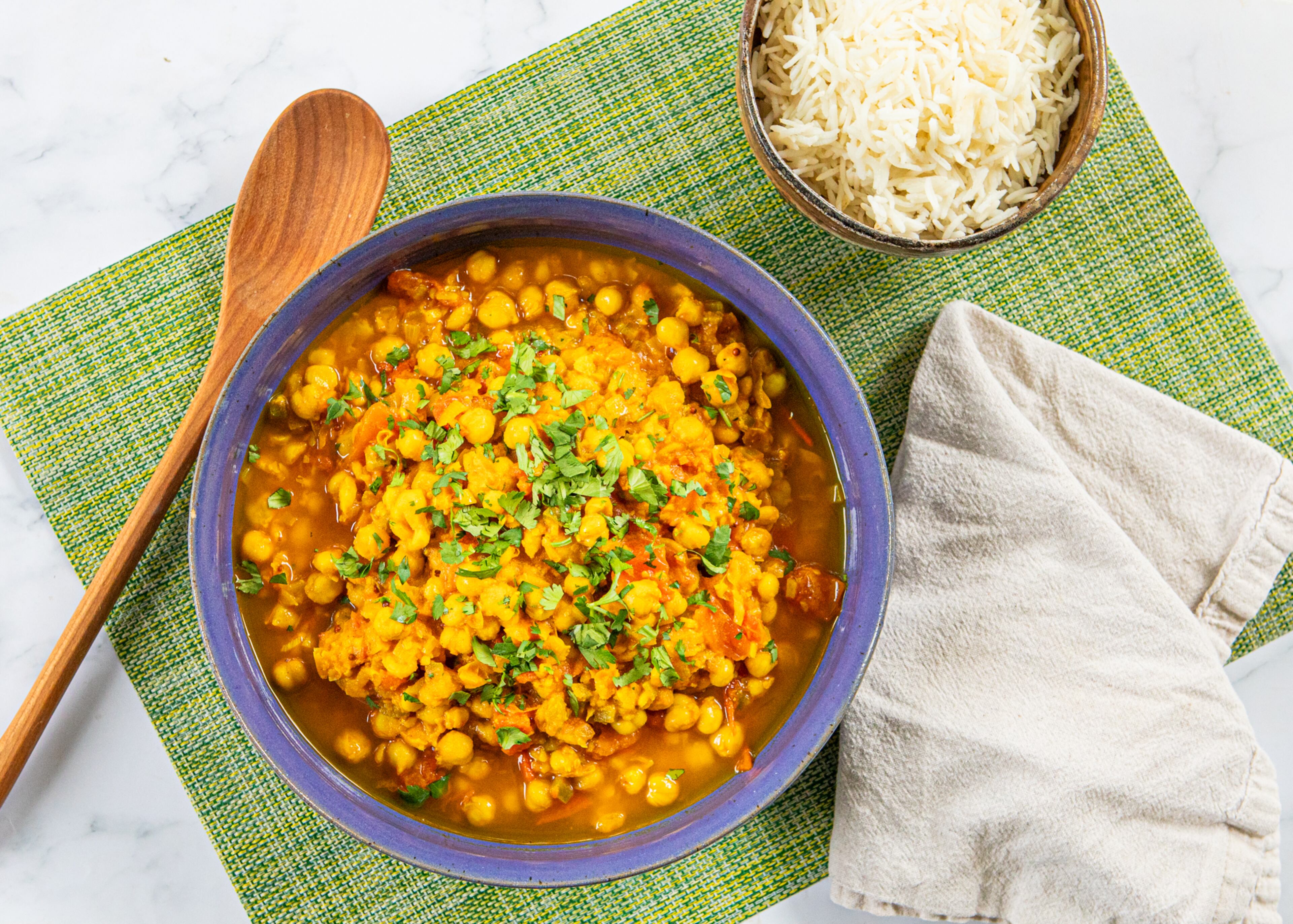 Hearty stews, like this chana masala, come together quickly when you keep beans on hand. (Aaliyah Man for the AJC/food styling by Kate Williams)