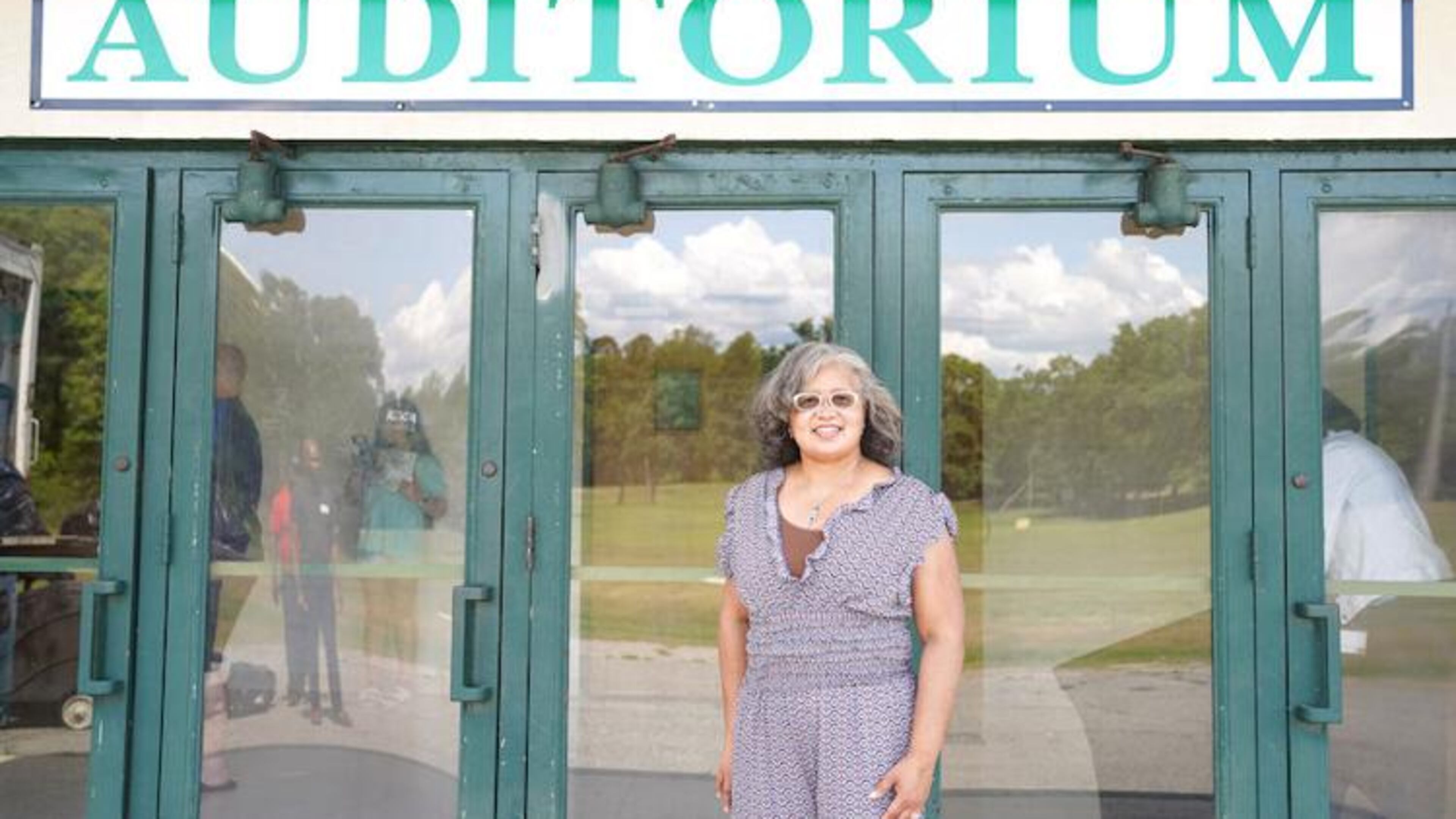 Tonya Thomas Berry stands in front of Emery Thomas Auditorium, named for her grandfather, in Dublin, GA. Emery Thomas Auditorium, the historic home of the Dublin 4-H Center, was recently named to the National Register of Historic Places.