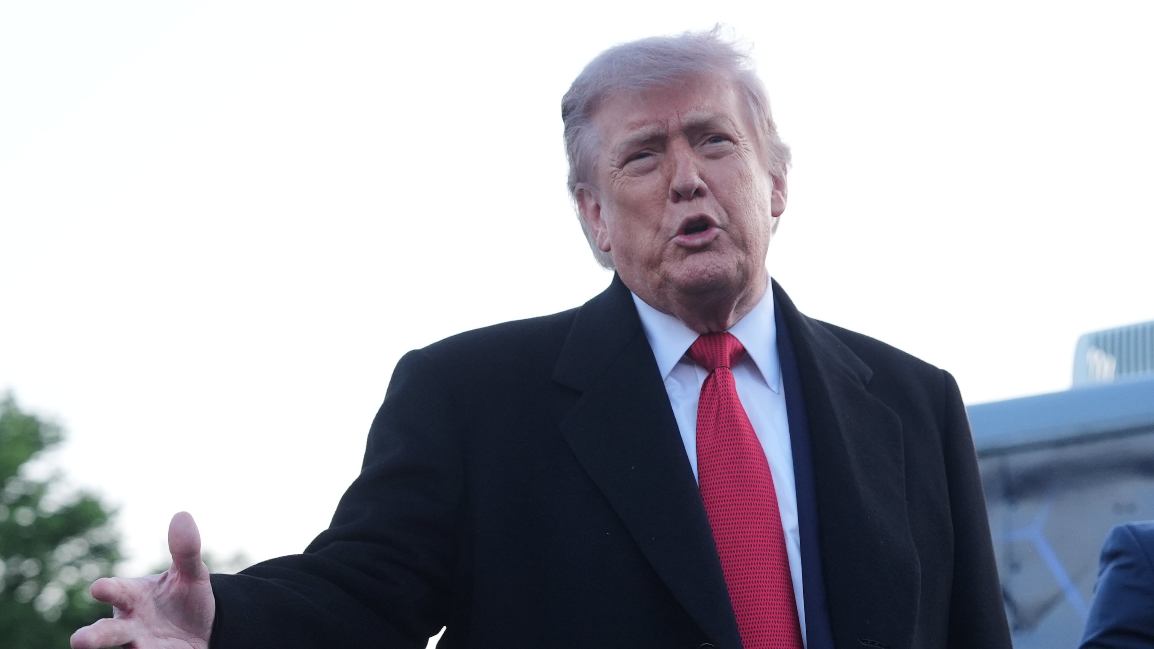 President Donald Trump speaks as he visits the Lincoln Memorial Reflecting Pool to see the new blue protective coating being applied as part of a renovation project, Thursday, May 7, 2026, in Washington. (AP Photo/Mark Schiefelbein)
