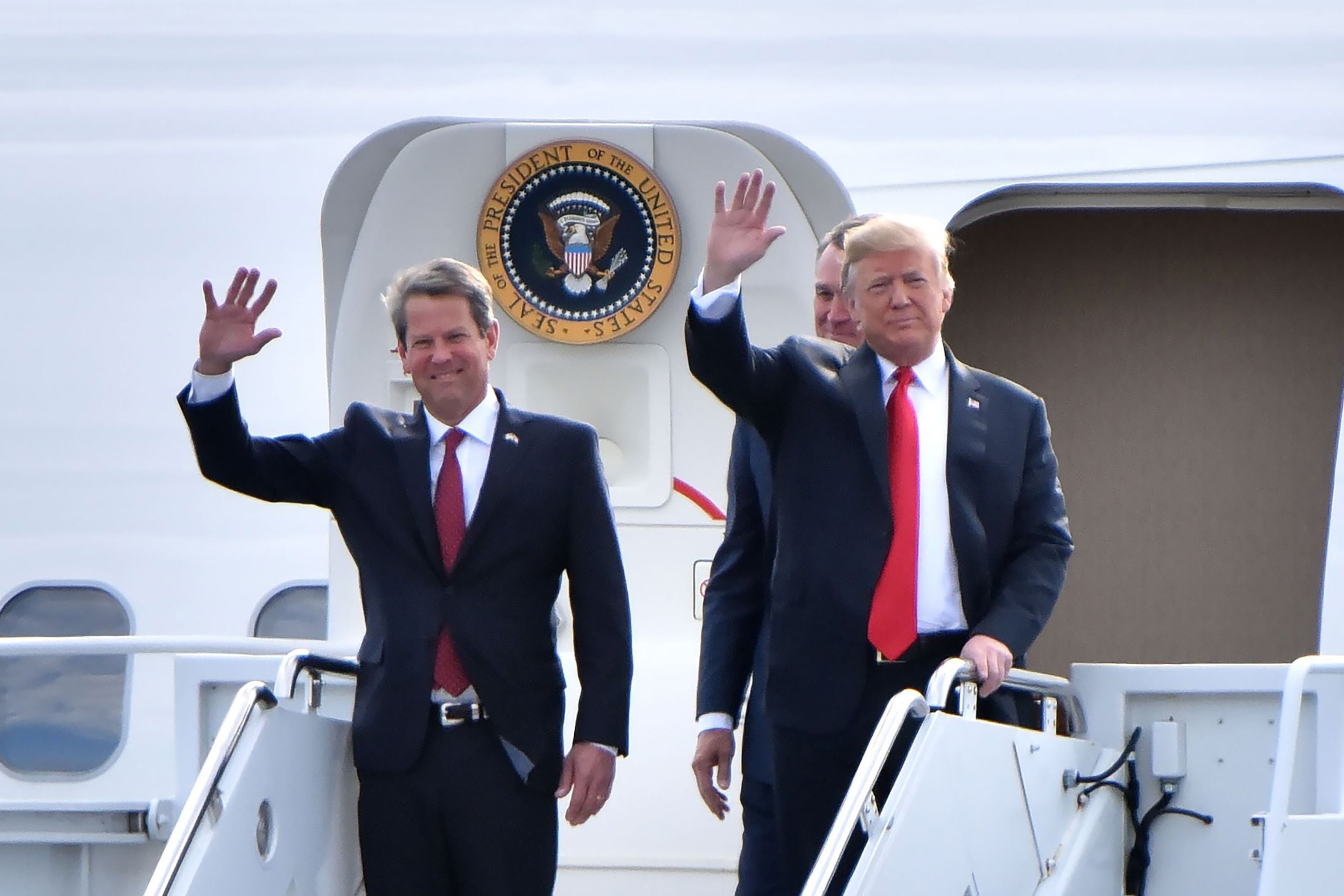 After winning reelection in November 2022, Gov. Brian Kemp, left, took a series of shots at former President Donald Trump as part of a feud that traces back to the 2020 presidential election. But he's backed off as the former president has seemingly solidified his standing at the front of the GOP field of presidential candidates in 2024 in many state and national polls. (Hyosub Shin/The Atlanta Journal-Constitution/TNS)