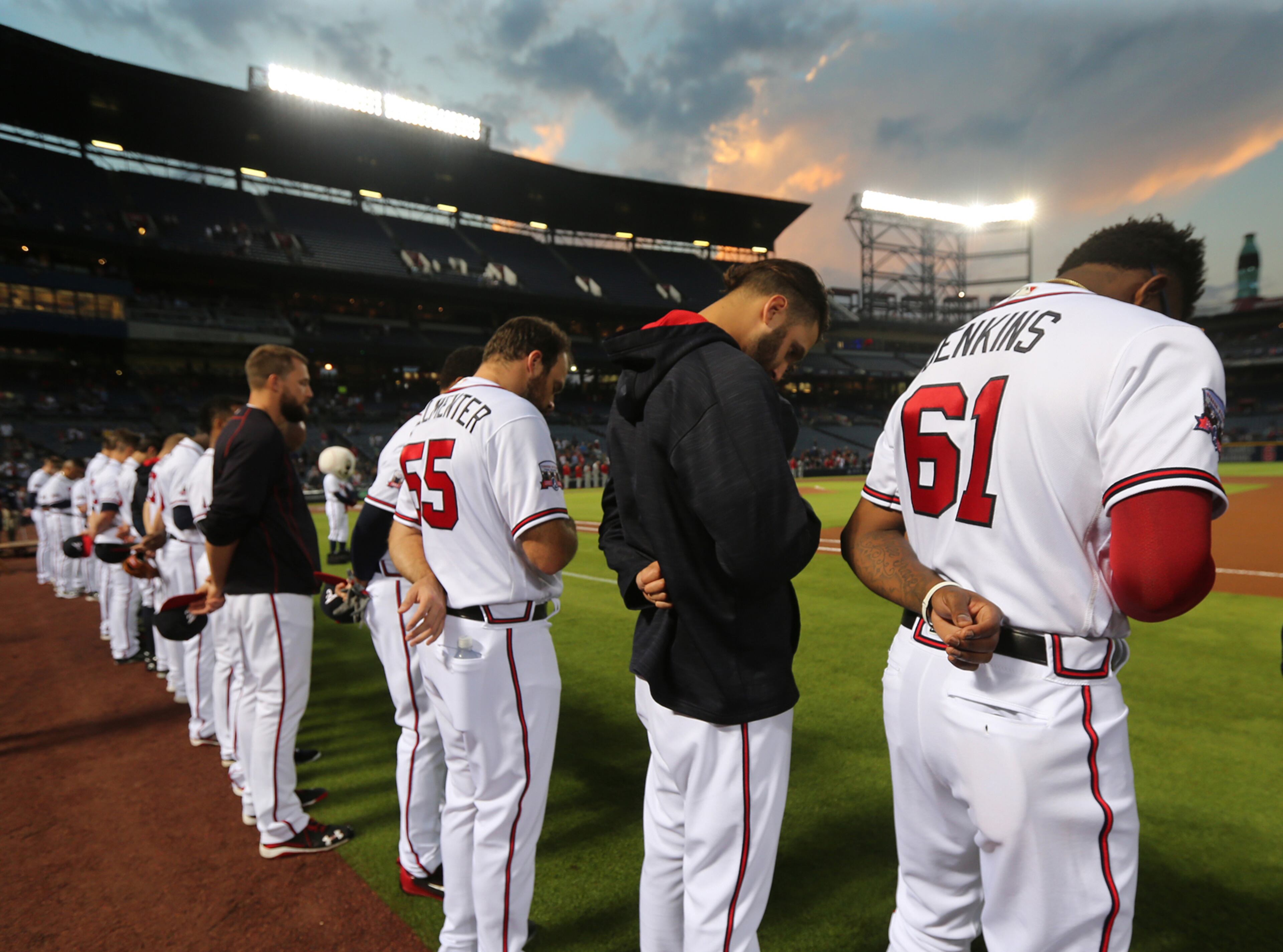 September 27, 2016 ATLANTA: The Atlanta Braves observe a moment of silence for Marlins pitcher Jose Fernandez, killed in a boating accident, while playing the Phillies to opent the first inning in a MLB baseball game at Turner Field on Tuesday, Sept. 27, 2016, in Atlanta. Curtis Compton /ccompton@ajc.com
