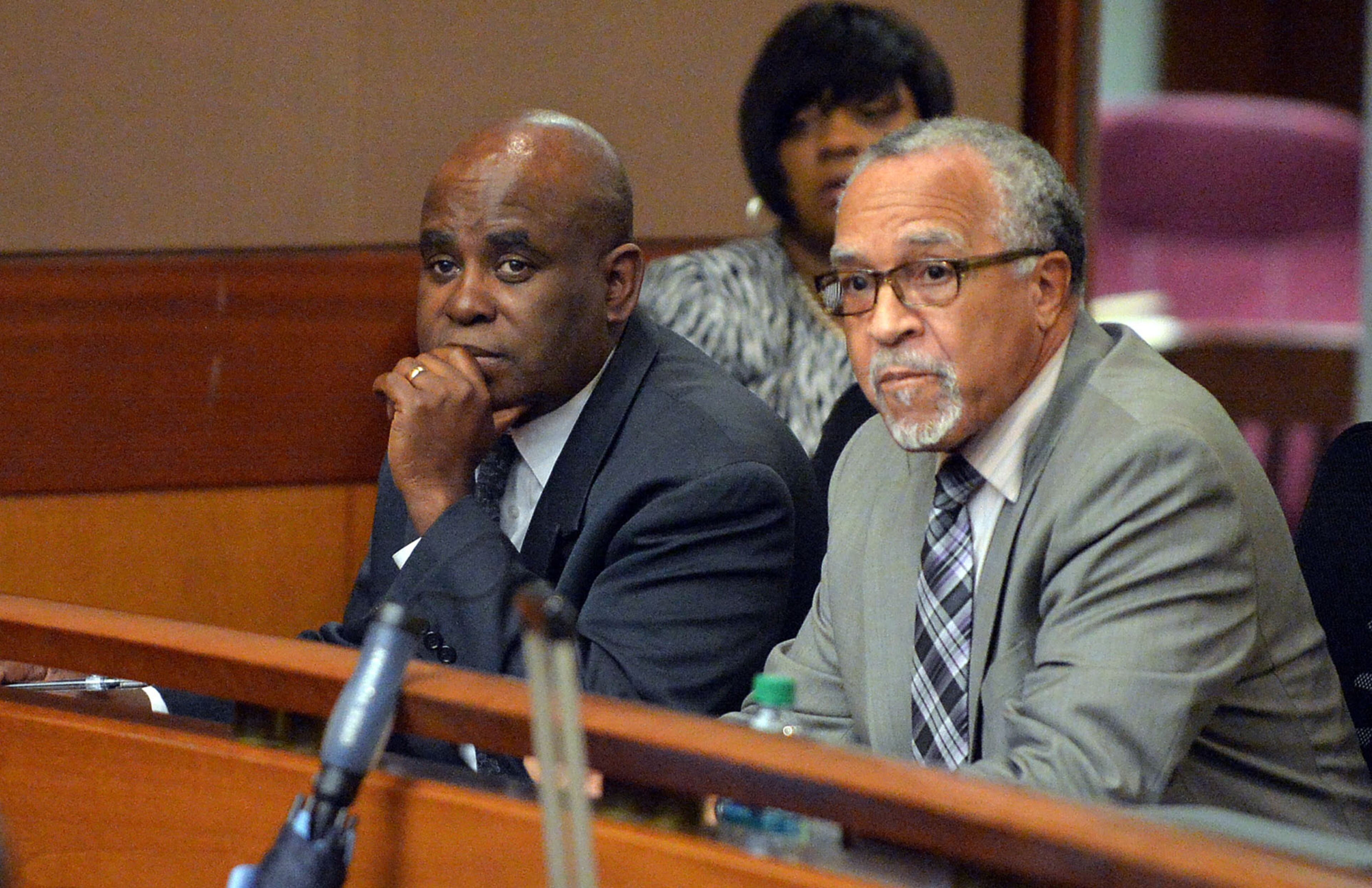 Former Usher Collier Heights Elementary School testing coordinator Donald Bullock and his defense attorney Hurl Taylor listen Wednesday as Fulton County Superior Court Judge Jerry Baxter reads a question from the jury. (Atlanta Journal-Constitution, Kent D. Johnson, Pool)