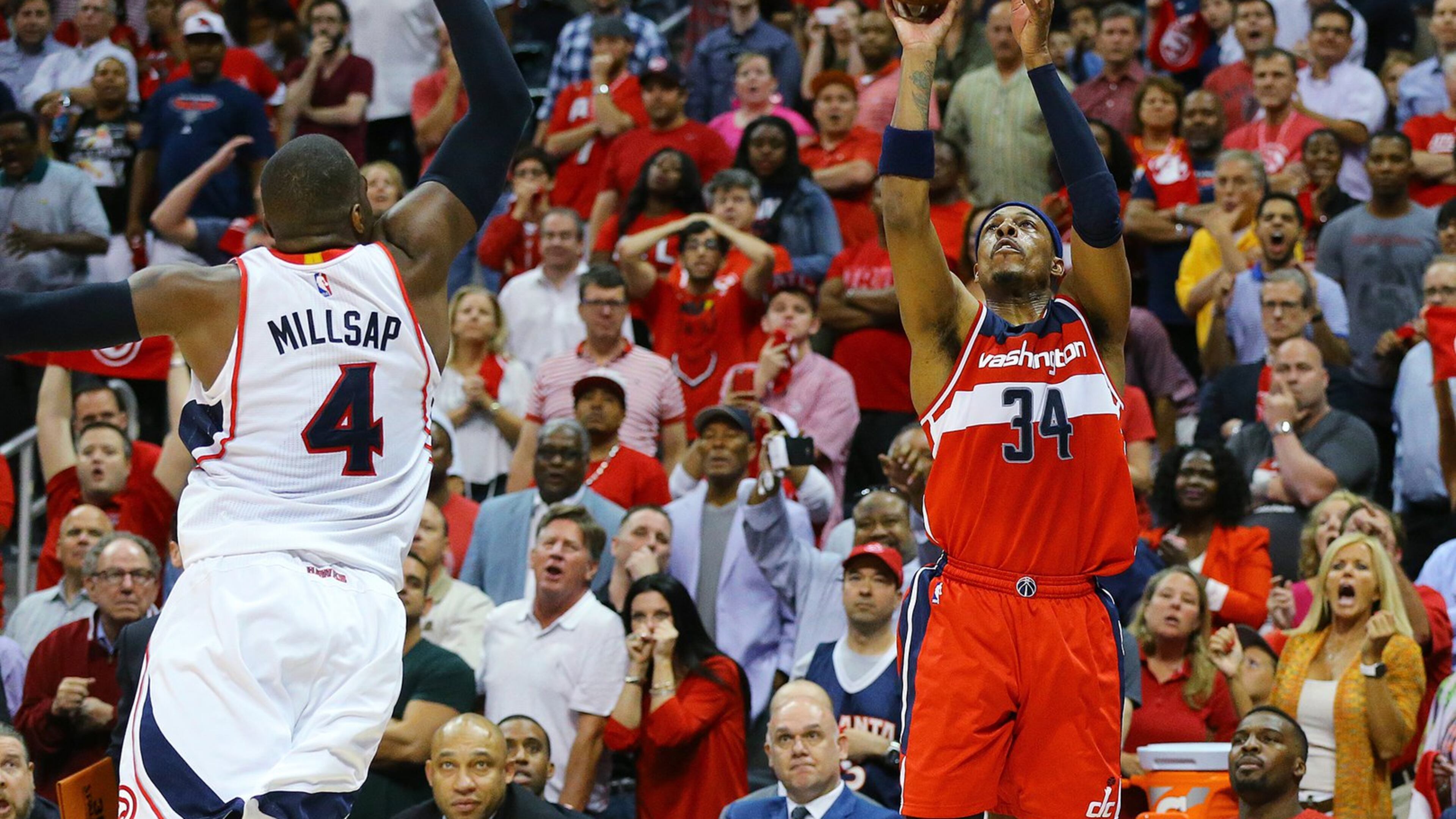 Wizards’ Paul Pierce hits a 3-pointer over Hawks’ Paul Millsap to take a 81-80 lead over the Hawks with 8.3 seconds left in the game. The Hawks came back with Al Horford hitting a two pointer to win the game 82-81 in their Eastern Conference semifinals Game 5 on Wednesday, May 13, 2015, in Atlanta. Curtis Compton / ccompton@ajc.com