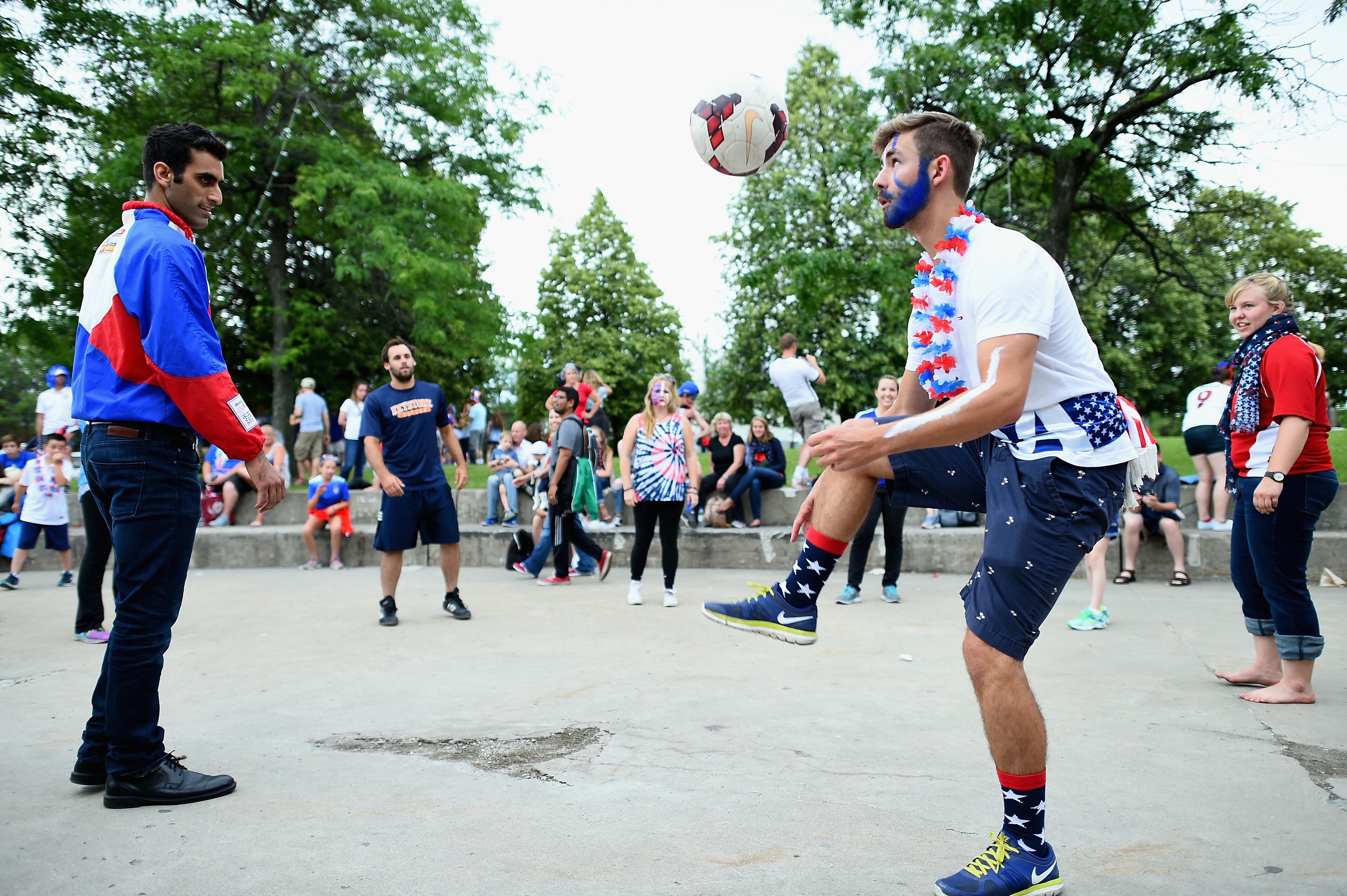 MONTREAL, QC - JUNE 30: Spectators play football ahead of the FIFA Women's World Cup 2015 Semi-Final Match at Olympic Stadium on June 30, 2015 in Montreal, Canada. (Photo by Dennis Grombkowski/Bongarts/Getty Images)