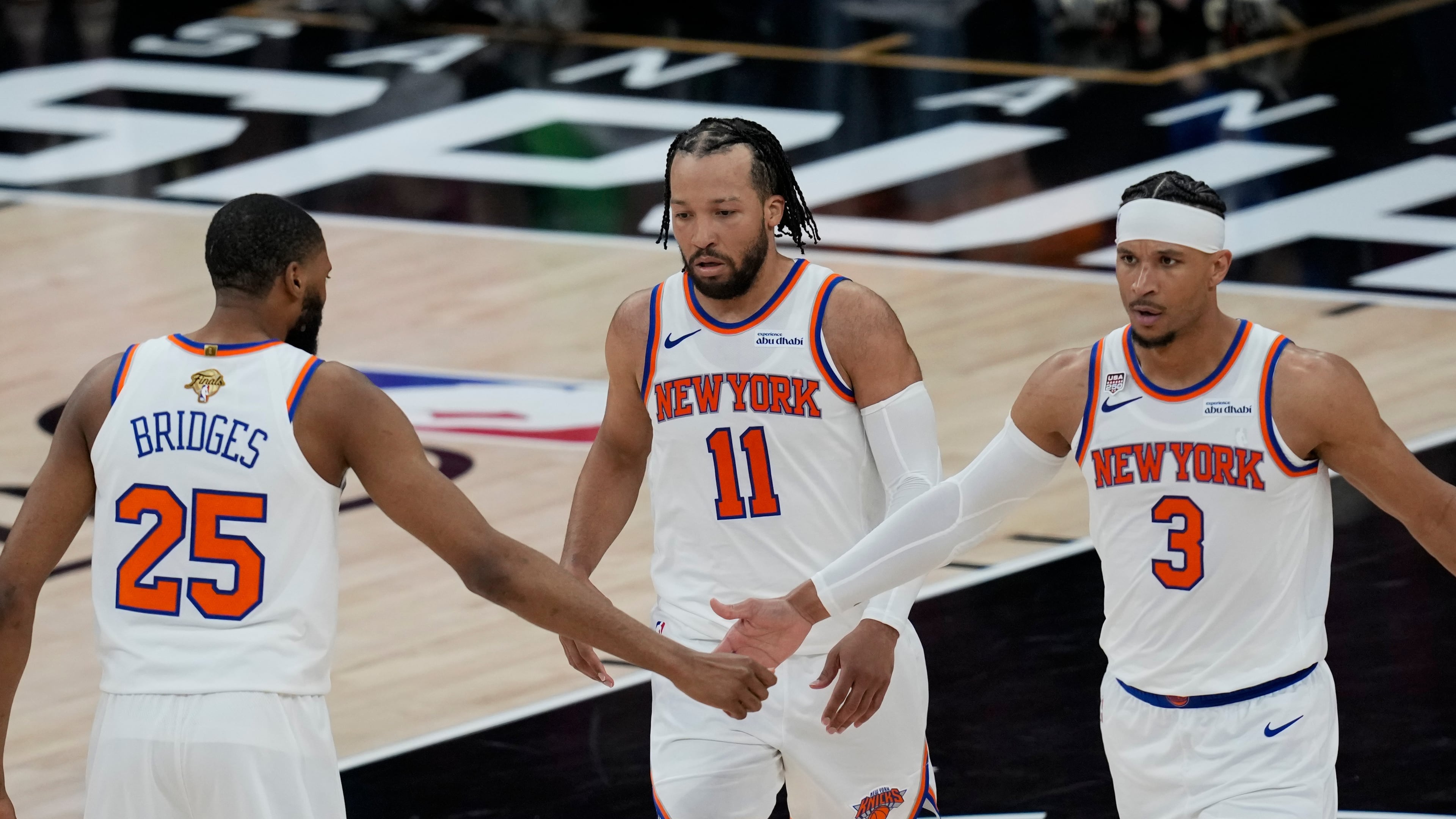 New York Knicks guard Josh Hart (3) greets guard Mikal Bridges (25) during the second half of Game 1 of the NBA Finals basketball series against the San Antonio Spurs, Wednesday, June 3, 2026, in San Antonio. (AP Photo/David J. Phillip)